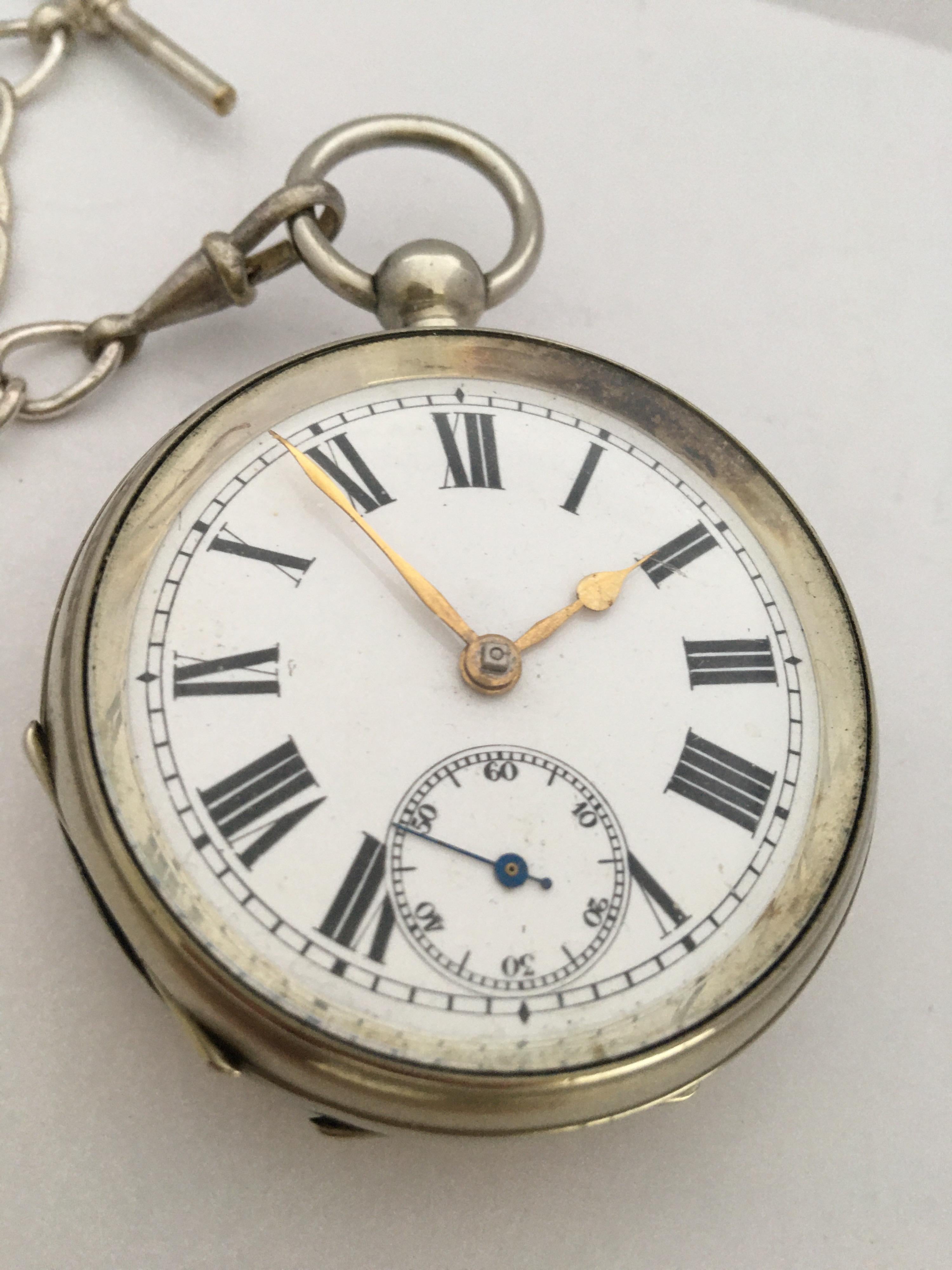 This charming silver plated pocket watch is in good working condition and it ticks nicely and runs well. Visible signs of ageing and gentle use. It comes with a silver plated pocket watch chain and a winding key .

Please study the images carefully