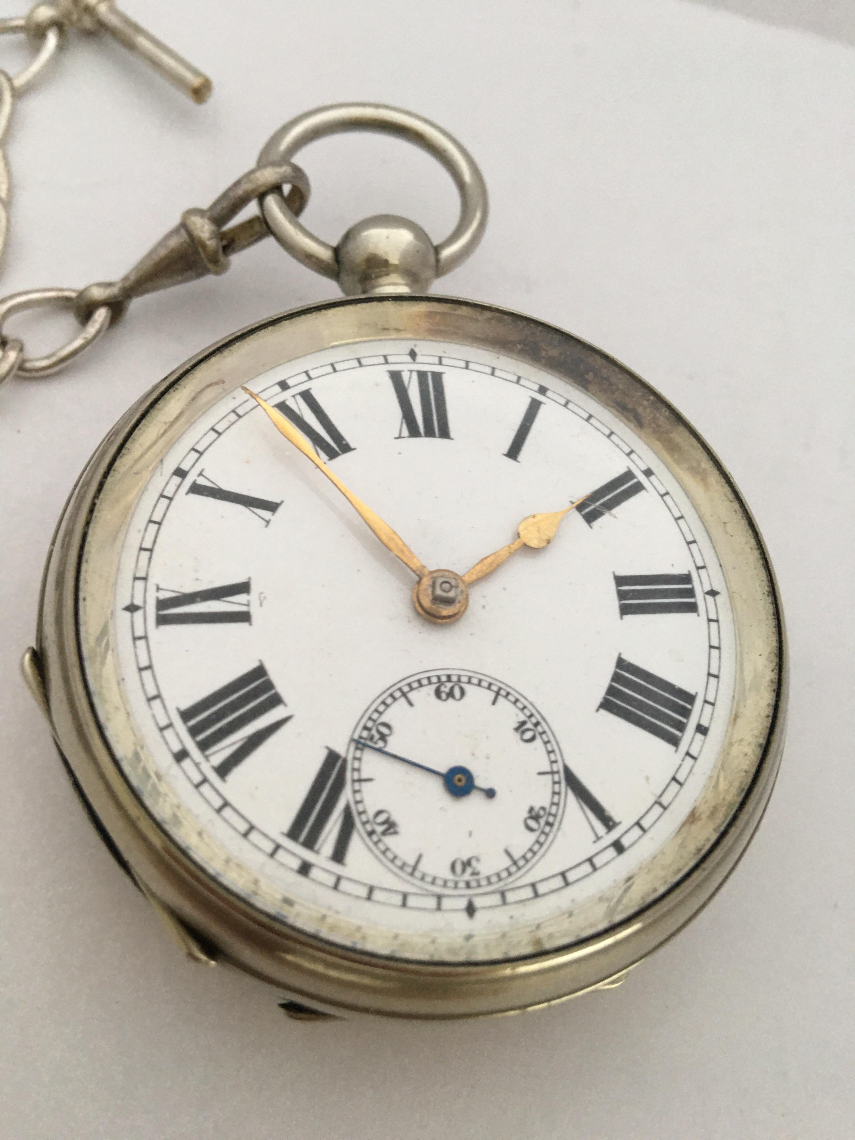 This charming silver plated pocket watch is in good working condition and it ticks nicely and runs well. Visible signs of ageing and gentle use. It comes with a silver plated pocket watch chain and a winding key .

Please study the images carefully