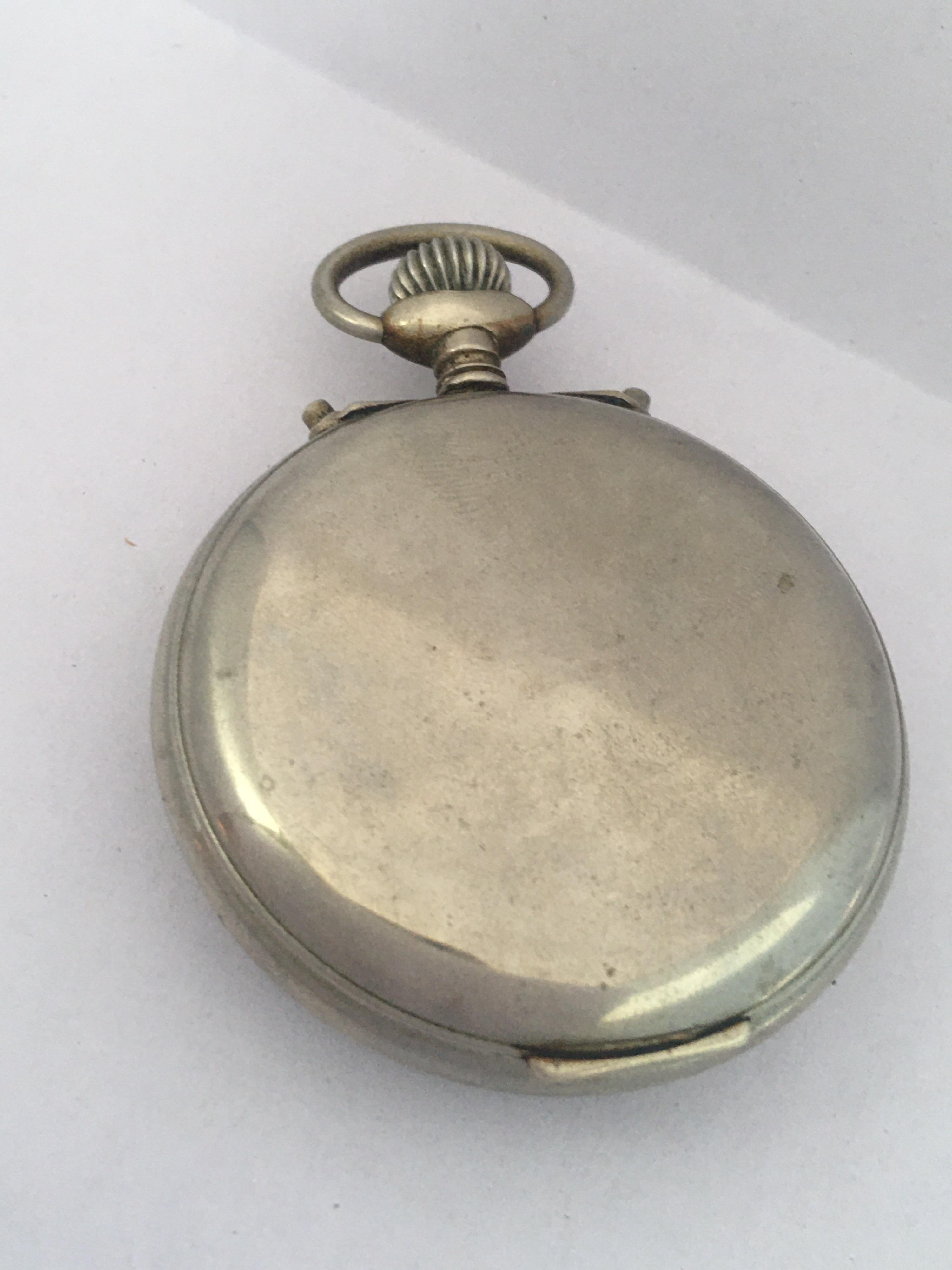 This beautiful antique hand winding alarm pocket watch is in good working condition and it is running well. the alarm functioning well. Visible signs of ageing and wear with light surface marks on the on the  watch case. Tiny hairline crack on the