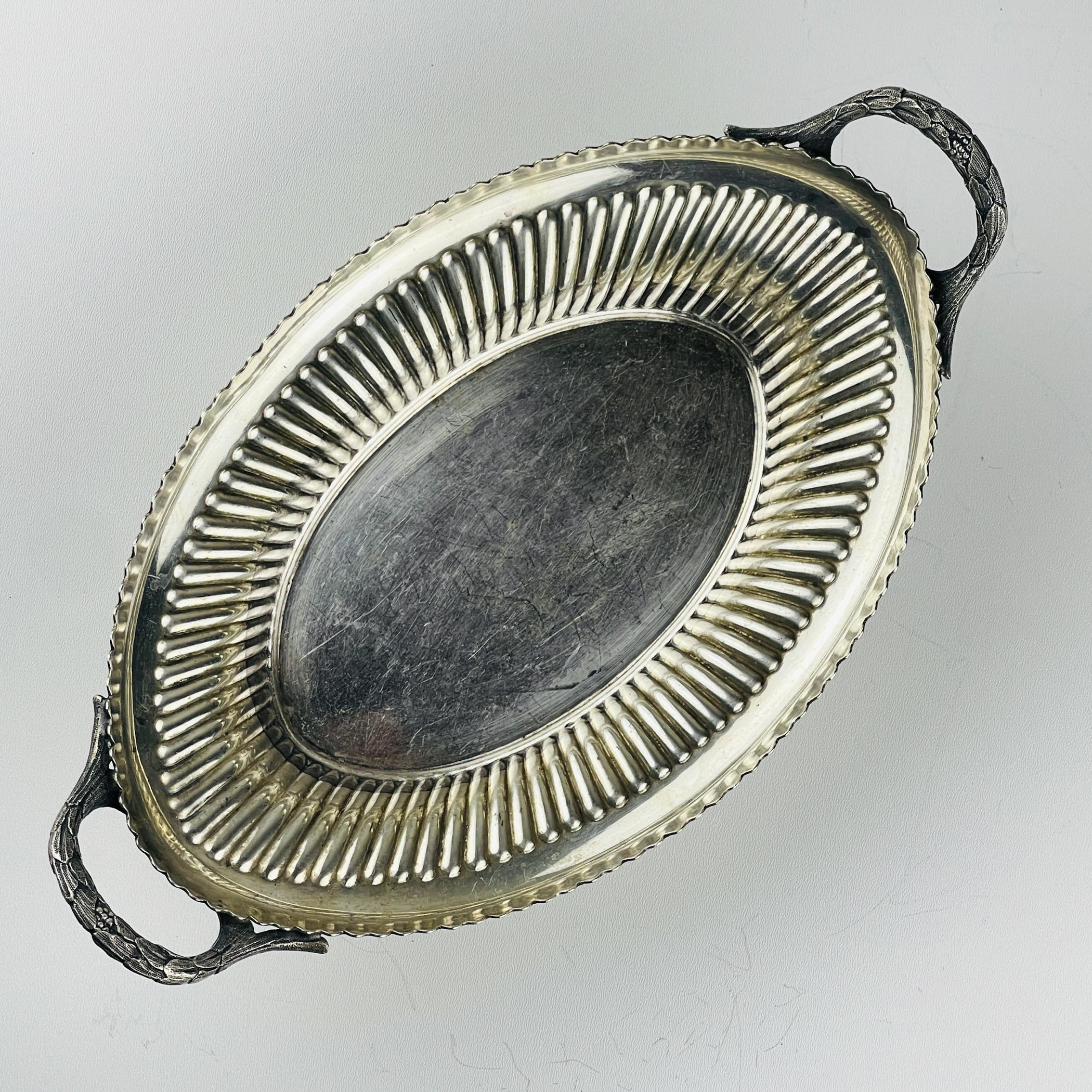 Amazing antique late Victorian period English silver plated bread serving dish or centerpiece fruit dish.

Walker & Hall is one of the oldest companies in Sheffield, founded in 1845, known for its silver and silver—plated metal products. The brand