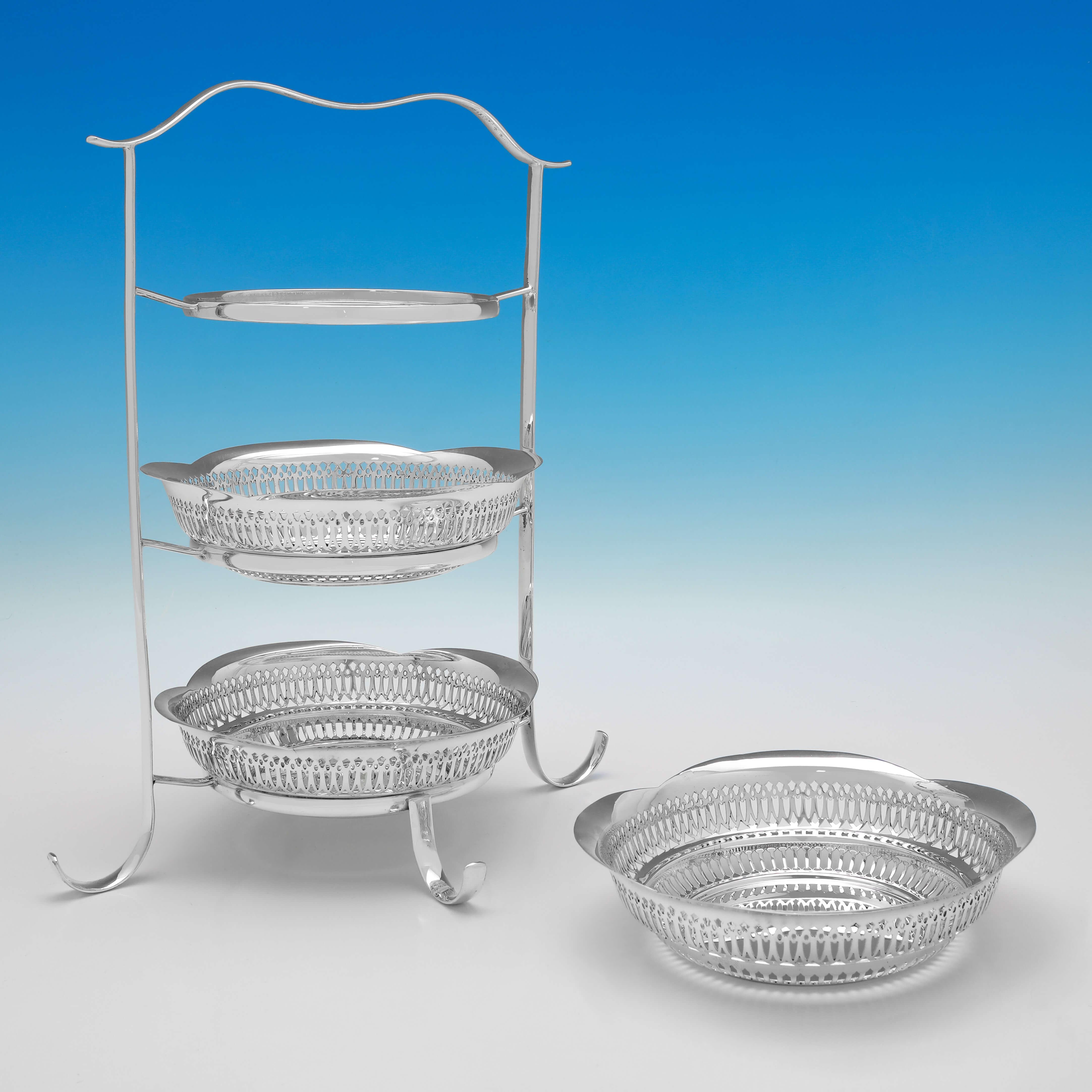 Made circa 1910 by Mappin and Webb, this attractive, antique silver plate cake stand, has 3 tiers, and features a plain stand, and lattice piercing to the dishes. The cake stand measures 13.5