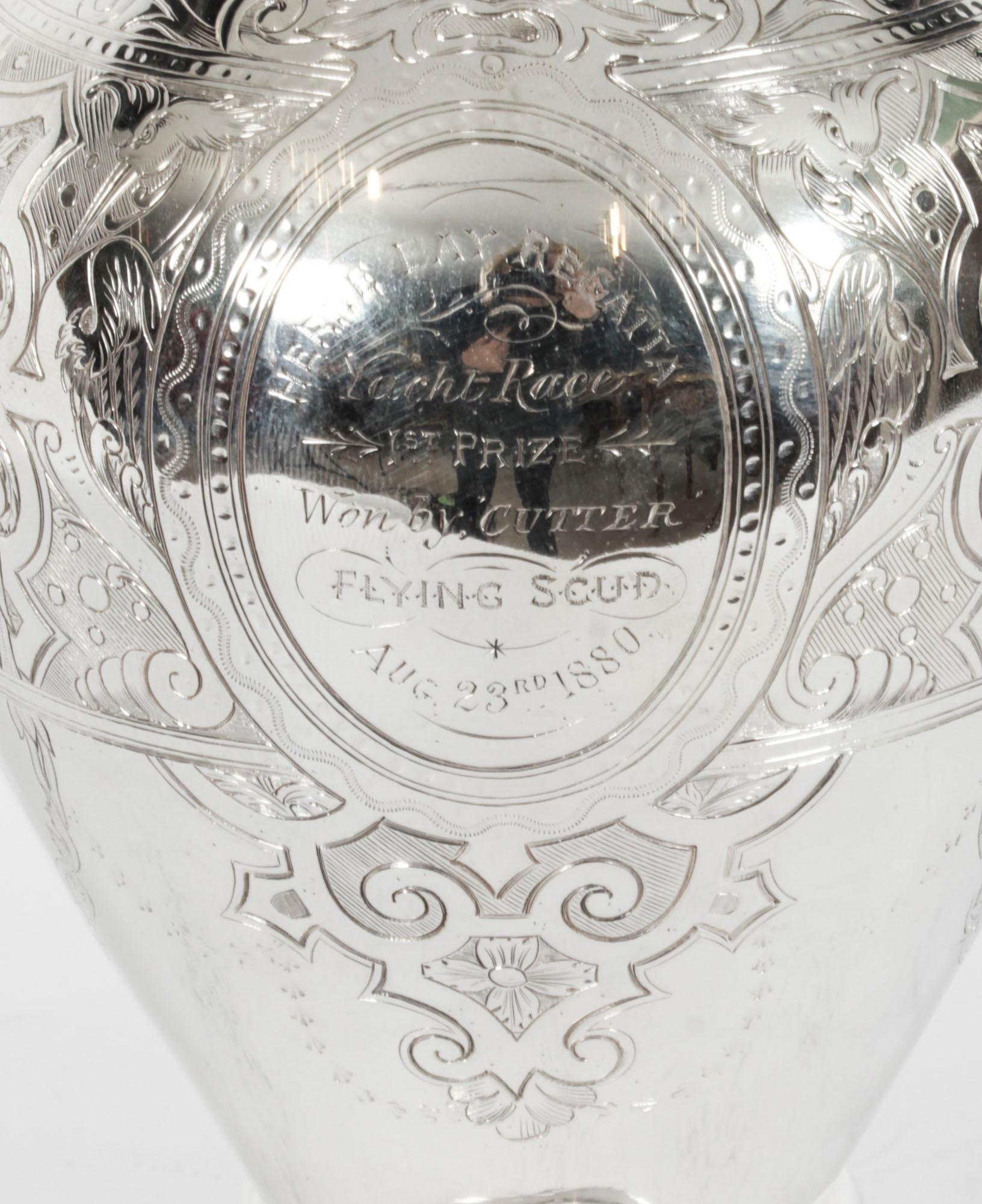 A wonderful antique English Victorian silver plate claret jug, circa 1880 in date.
 
It has an impressive handle and is embellished with the most wonderful engraved decoration.
 
It bears an interesting inscription
 
HERNE BAY REGATTA
YACHT