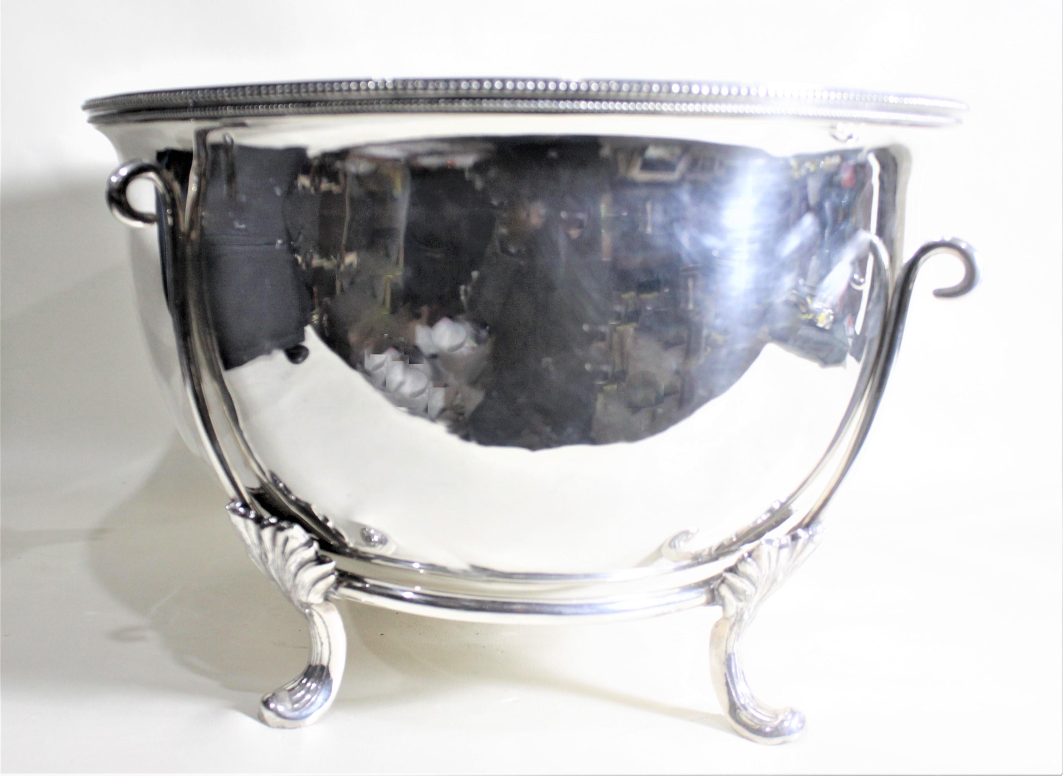 This extremely large and substantial ice trough or centerpiece is a marriage of an inverted huge meat dome with a custom made stand. The meat dome has no maker's mark, but presumed to have been made in England in circa 1890. The handle of the dome