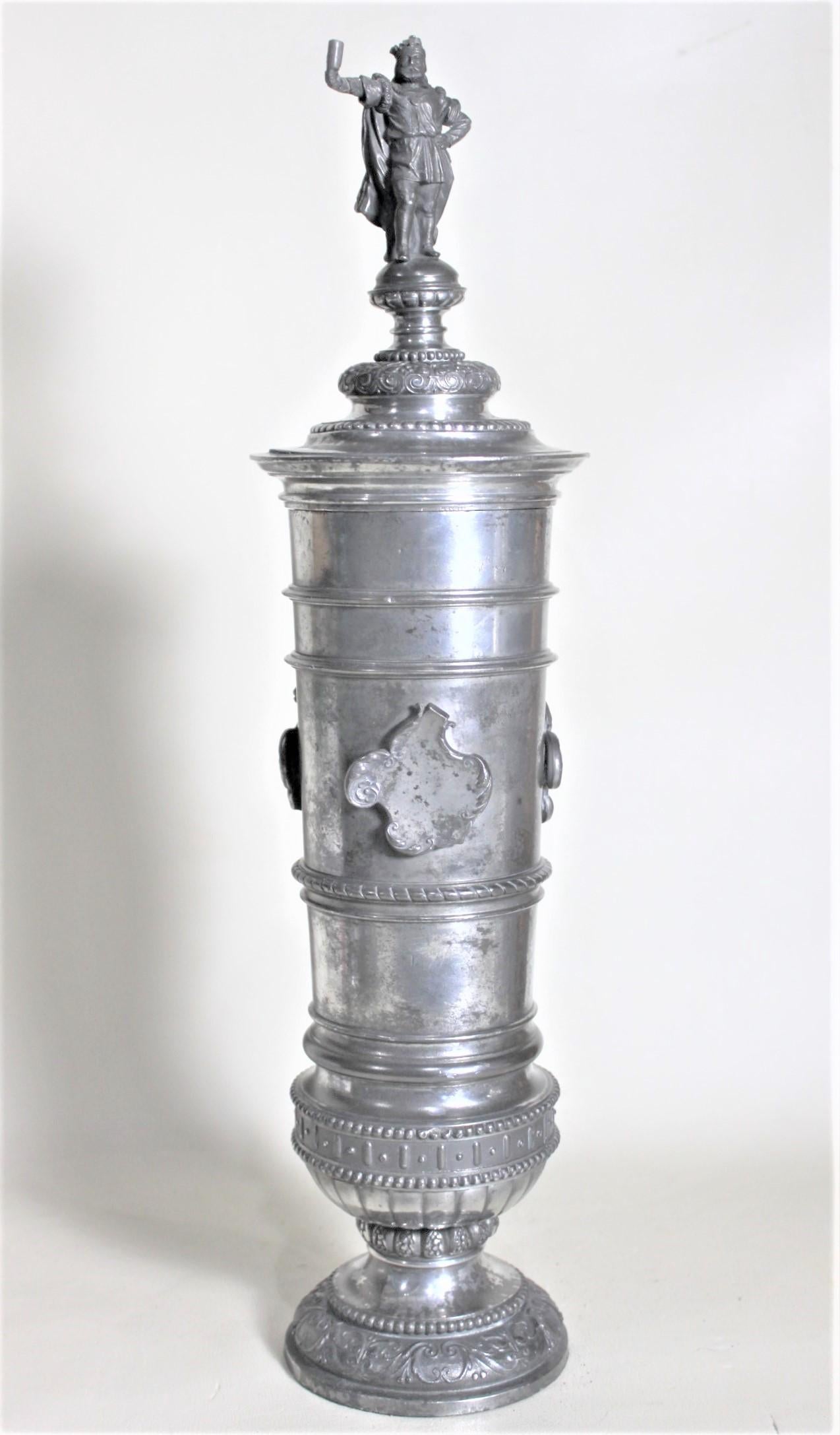 This antique silver plated covered urn or chalice shows no maker's marks but is presumed to have been made in England in circa 1900 in the period Edwardian style. This chalice could have been made for the purposes of a trophy as it has figural