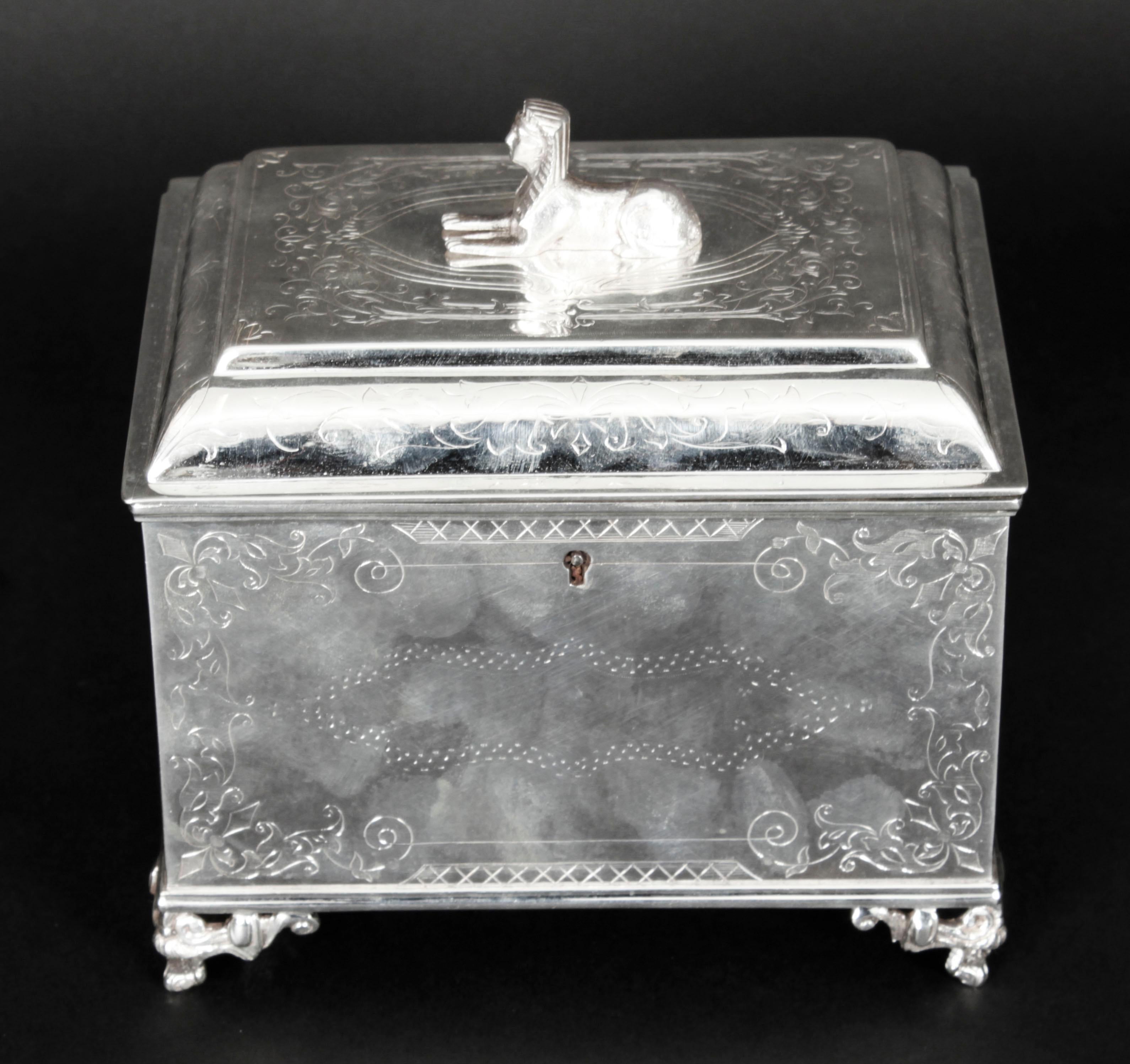This is a very attractive antique Empire Revival silver plated tea caddy, circa 1860 in date.

The rectangular lidded caddy features exquisite engraved decoration and is topped with a decorative Sphynx. 
 
Add an elegant touch to your next