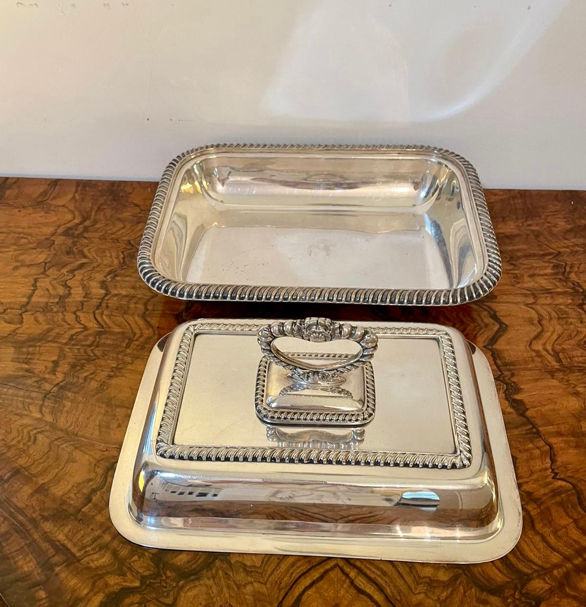Antique silver plated entrée dish having a pretty quality ornate handle above a lift off shaped lid and a silver plated dish with a cast border.

A superb example in lovely original condition.

Measures: ??H 14cm
W 28cm
D 21cm
 Date 1880.
 