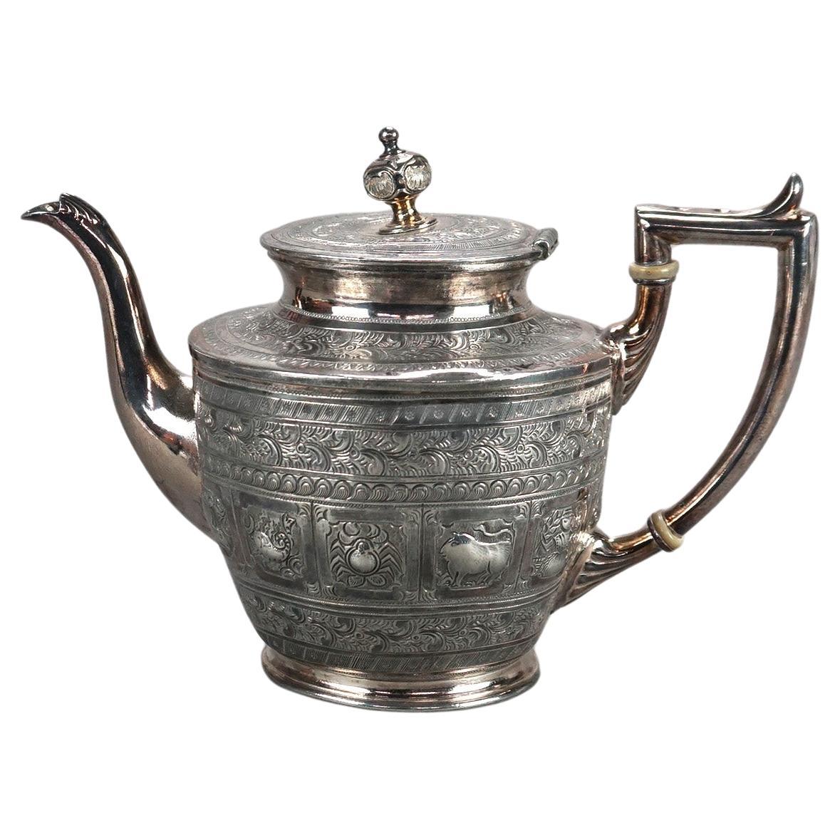 Antigua tetera figurada plateada C1890