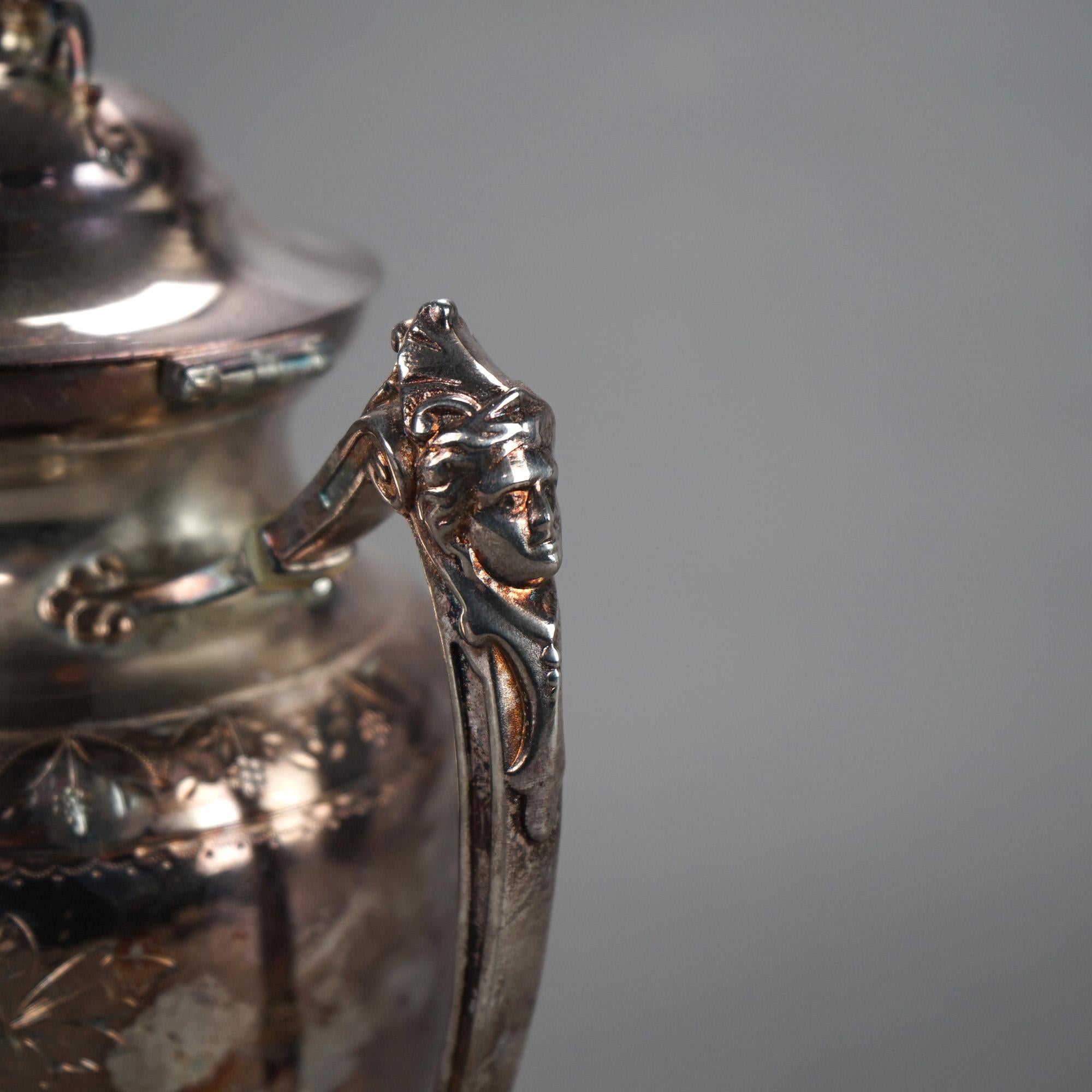Antique Silver Plated Footed & Figural Teapot with Foliate Engraving and Female Mask C1890

Measures - 11.5