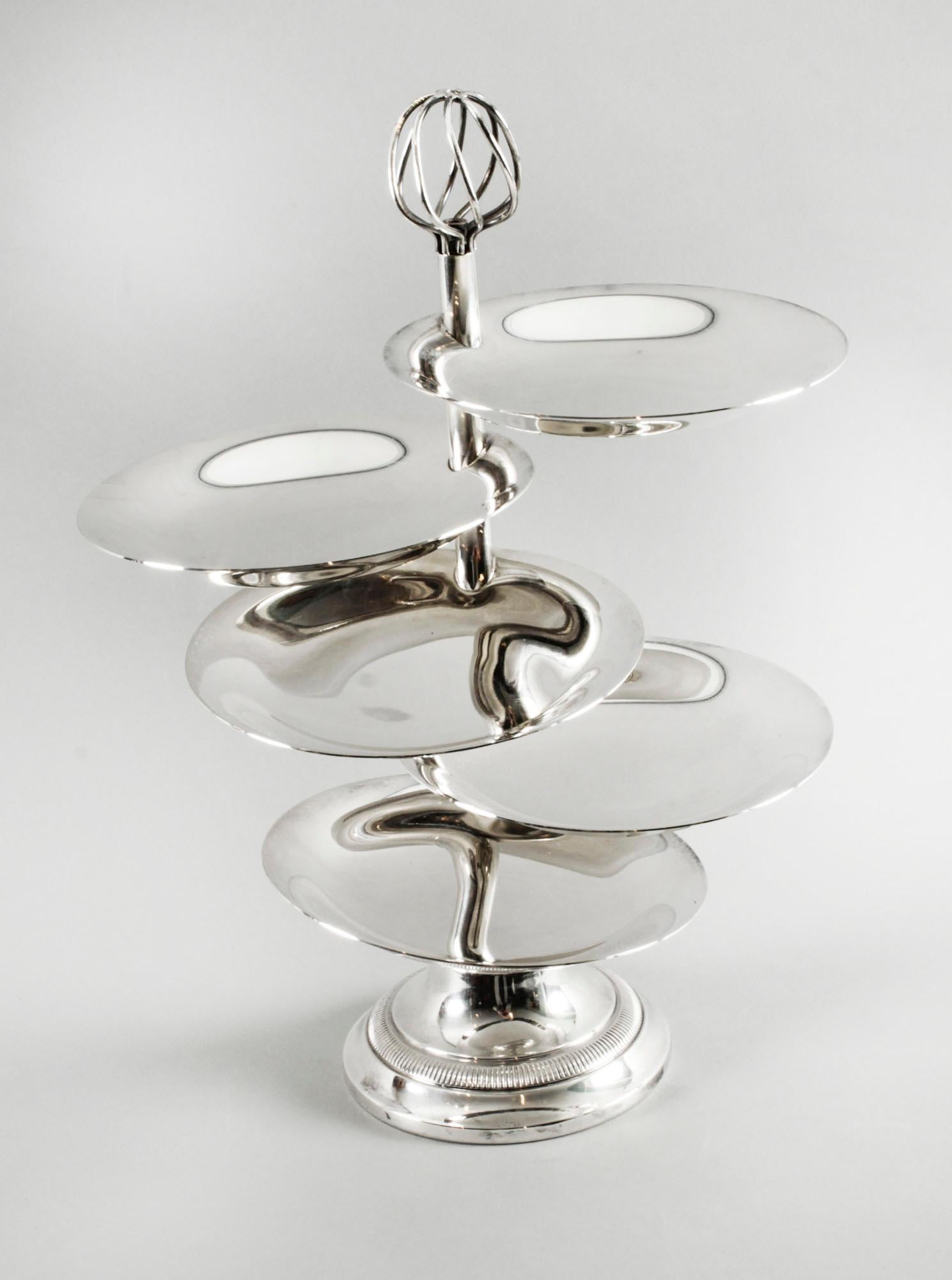 A top quality French Christofle silver plated layered hors d'oeuvres stand. The wrythen finial above five articulated plain polished bowls raised upon a spreading circular foot, bearing the makers mark for Christofle, the highly sought after French