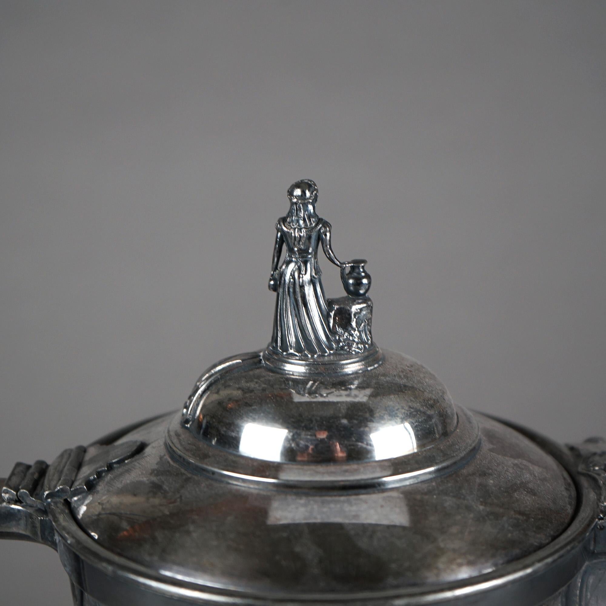 Antique Silver Plated Insulated Water Pitcher with Mask and Figural Finial C1890

Measures - 13
