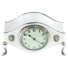 Horloge de cheminée ancienne en métal argenté
