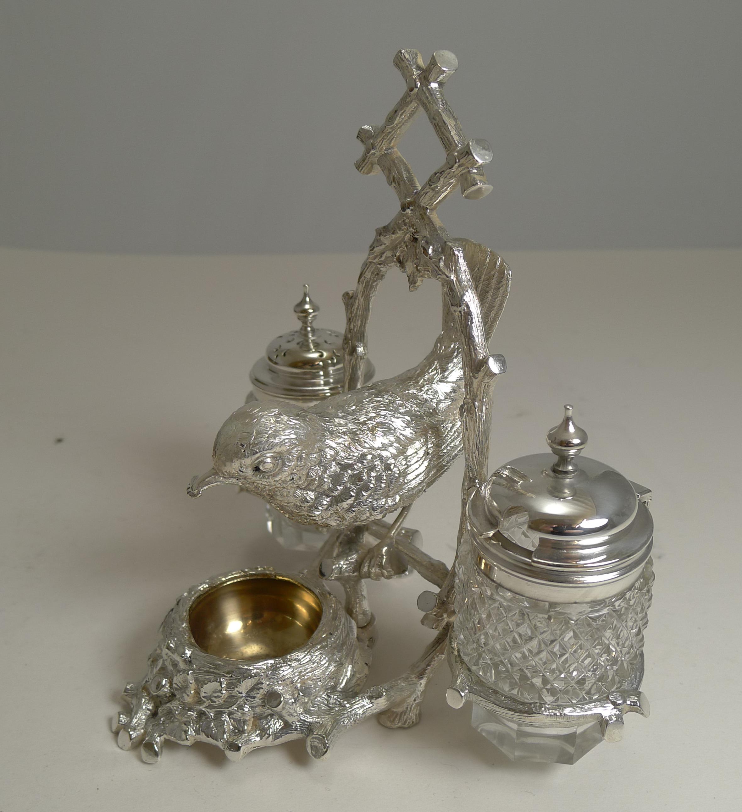An absolutely charming and unusual novelty table cruet made from English silver plate with a full signature on the underside for the well renowned silversmith, Fenton Brothers of Sheffield.

The naturalistic frame with its integral handle holds