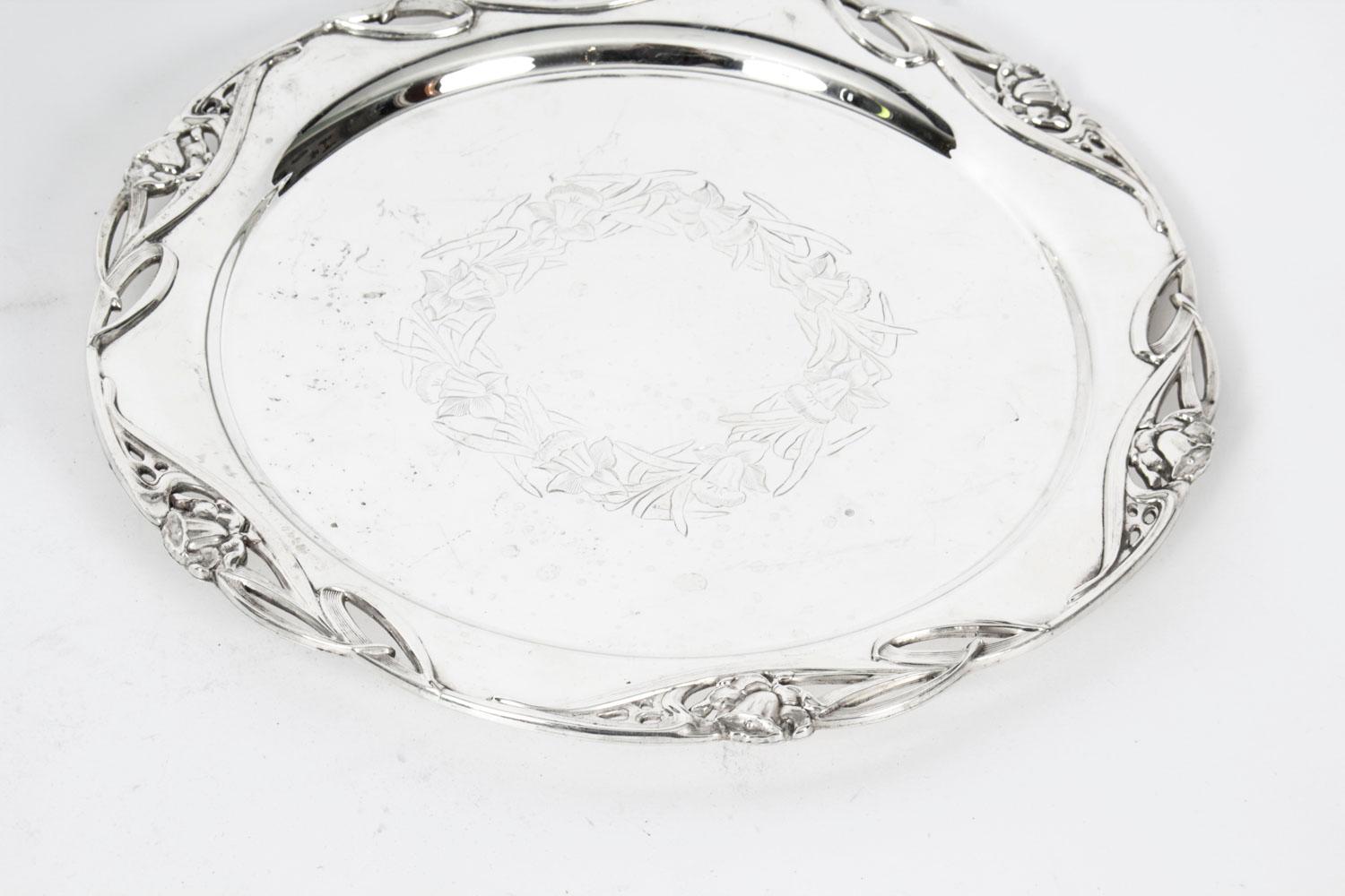 This is an exquisite English antique silver plated salver bearing the cross arrows makers mark, and the mark WH & S for William Hutton & Son, and the registration number Rd 458840.

Add an elegant touch to your next dining experience with this