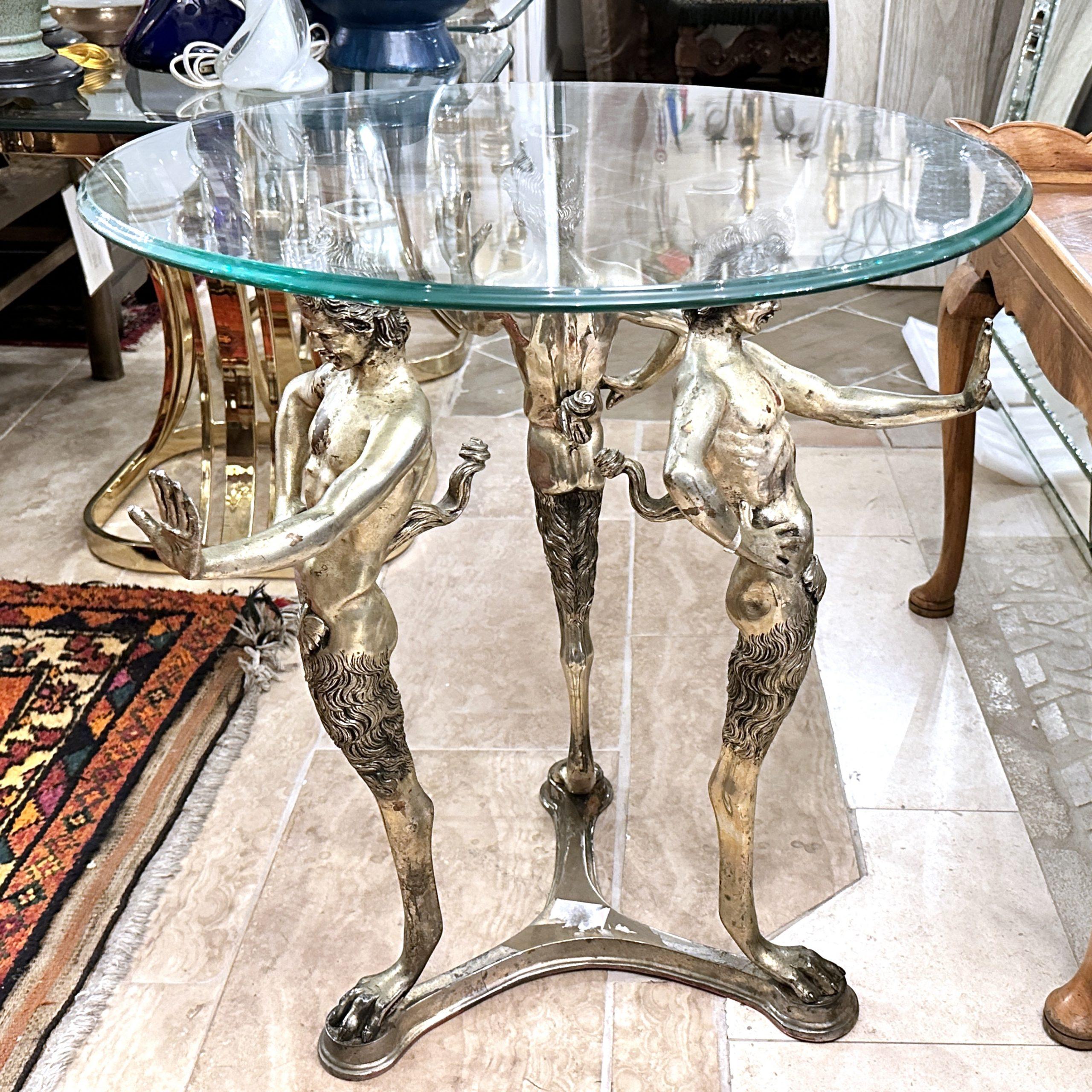 A circa 1900s Italian Grand Tour side table with satyrs and glass top.

Measurements:
Diameter: 24