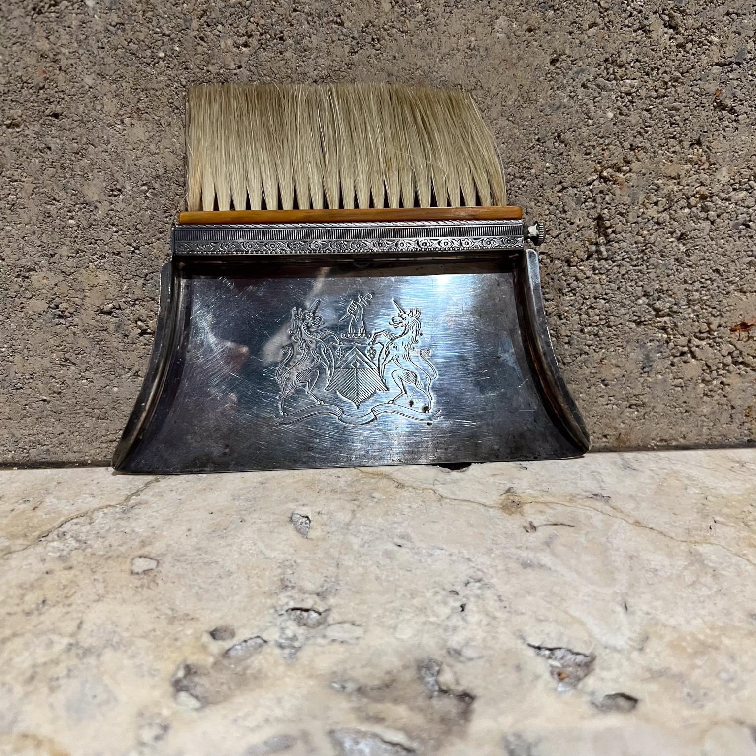 Antique Silver-Plated Silent Butler Crumb Catcher Bakelite Brush
The Sheffield Silver Company
Silent Butler Crumb Catcher
Silver plated tray and brush
Unicorn design
4.75 h x 6 w x .38
Original vintage unrestored, refer to all images.