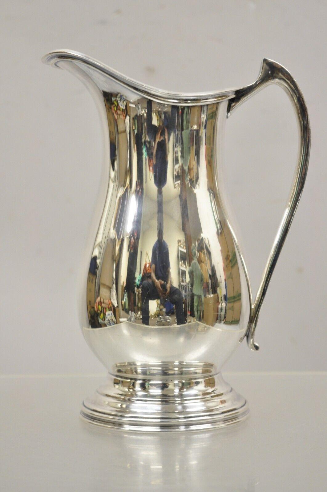 Antique Silver Plated Victorian Water Pitcher By The Sheffield Silver Co. Circa Mid 20th century. Measurements: 10