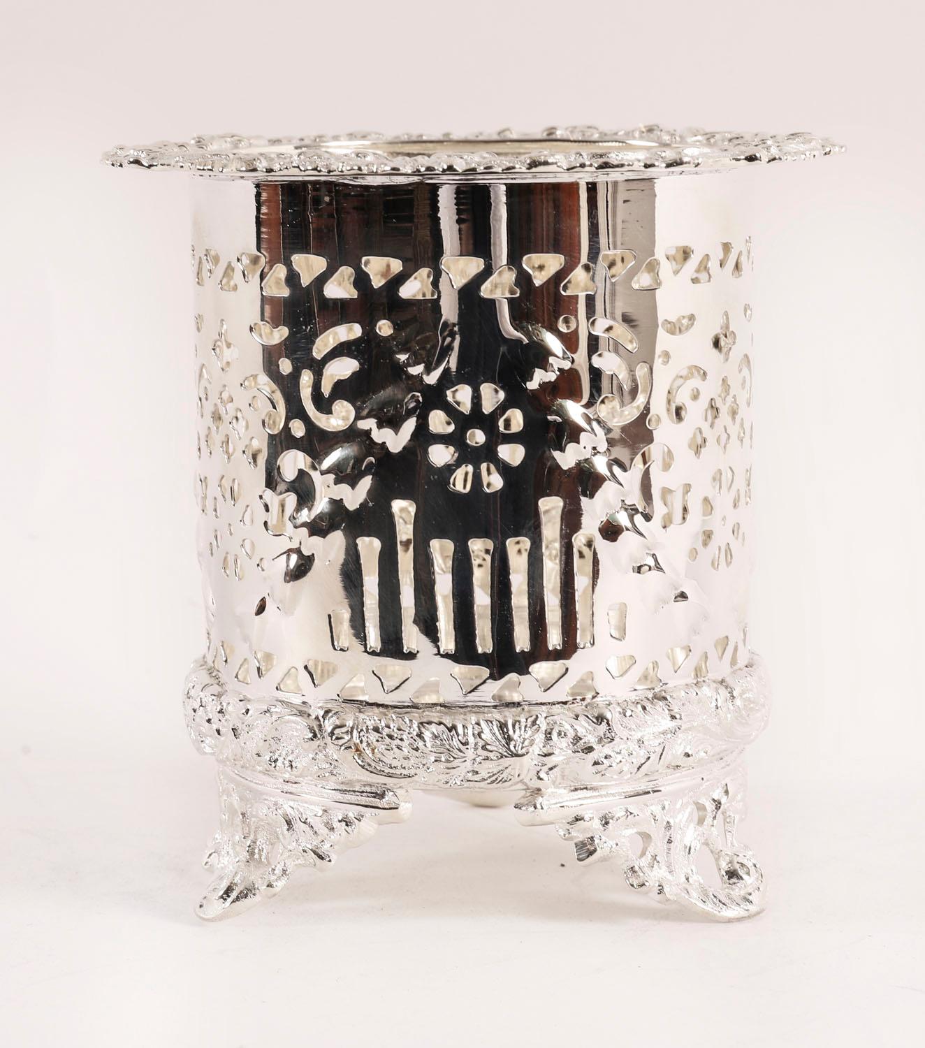 A very attractive antique silver plated wine coaster with pierced and embossed decoration, bearing the impressed makers mark JD on the base and dating from Circa 1920.

A highly versatile piece which could also serve as a grandiose pen holder.

Add