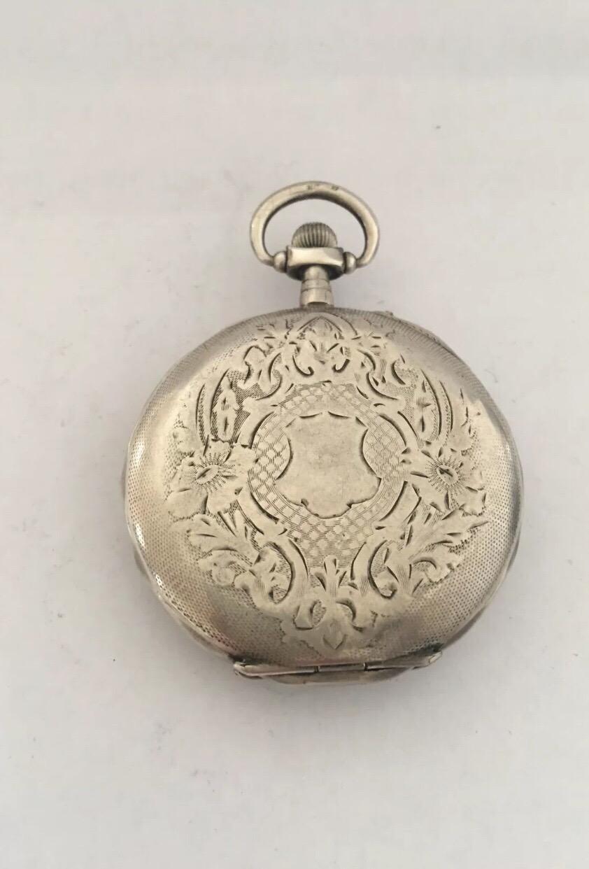 Antique Silver Pocket Watch. Condition is Used. This watch is in good working order. A visible hairline crack on the dial.please study the photos carefully as form part of the description 