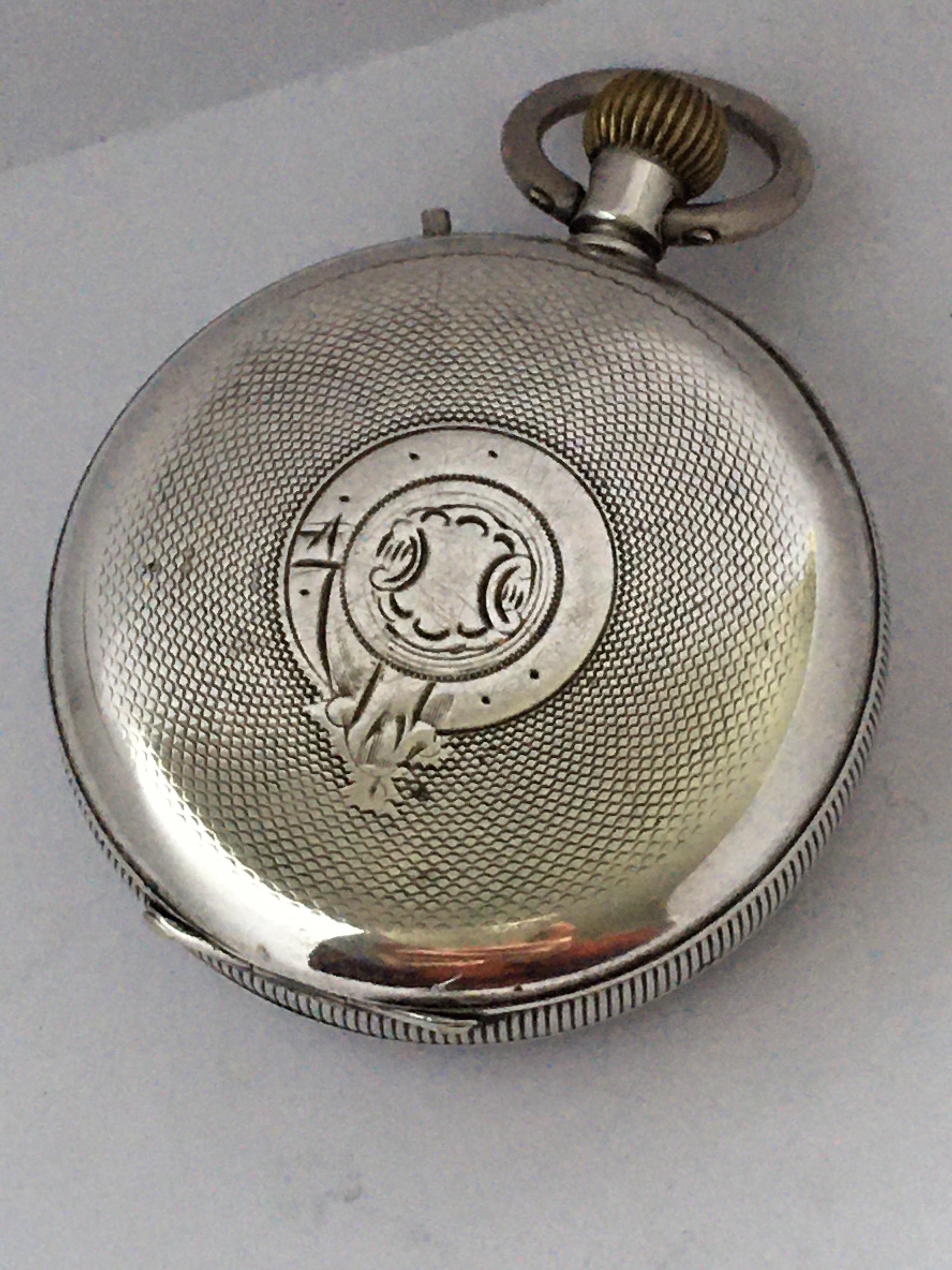 This beautiful antique silver stem-winding pocket watch signed Le Roí on the dial is in good working condition and it is ticking well. Visible crack across the enamel dial as shown. Tiny dents, light scratches on the engine turned silver case.