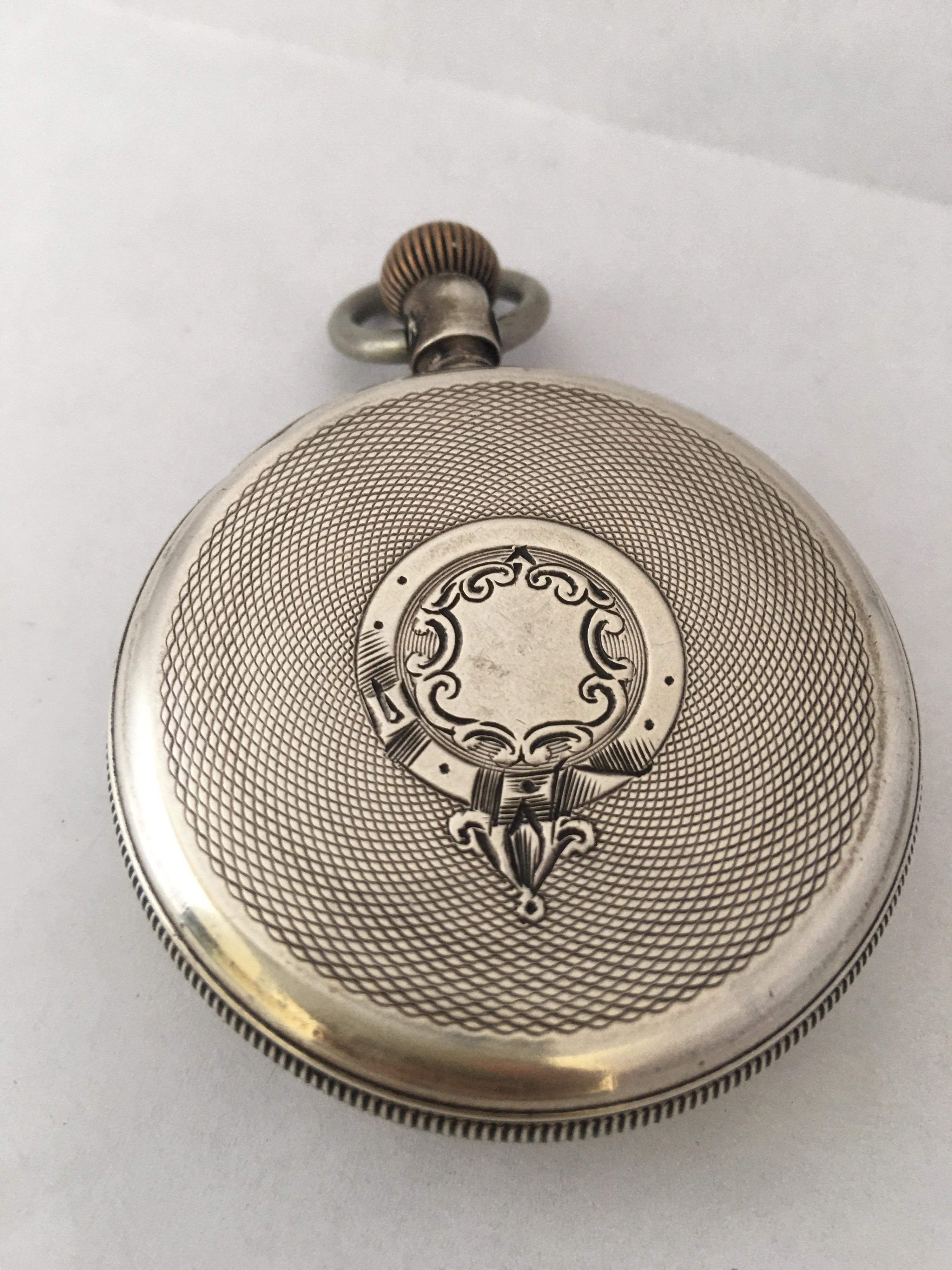 This beautiful antique silver hand-winding pocket watch is in good working condition and it is ticking and runs well. Visible signs of ageing and used with small scratches on the glass and tiny dents and scratches on the the silver watch case as