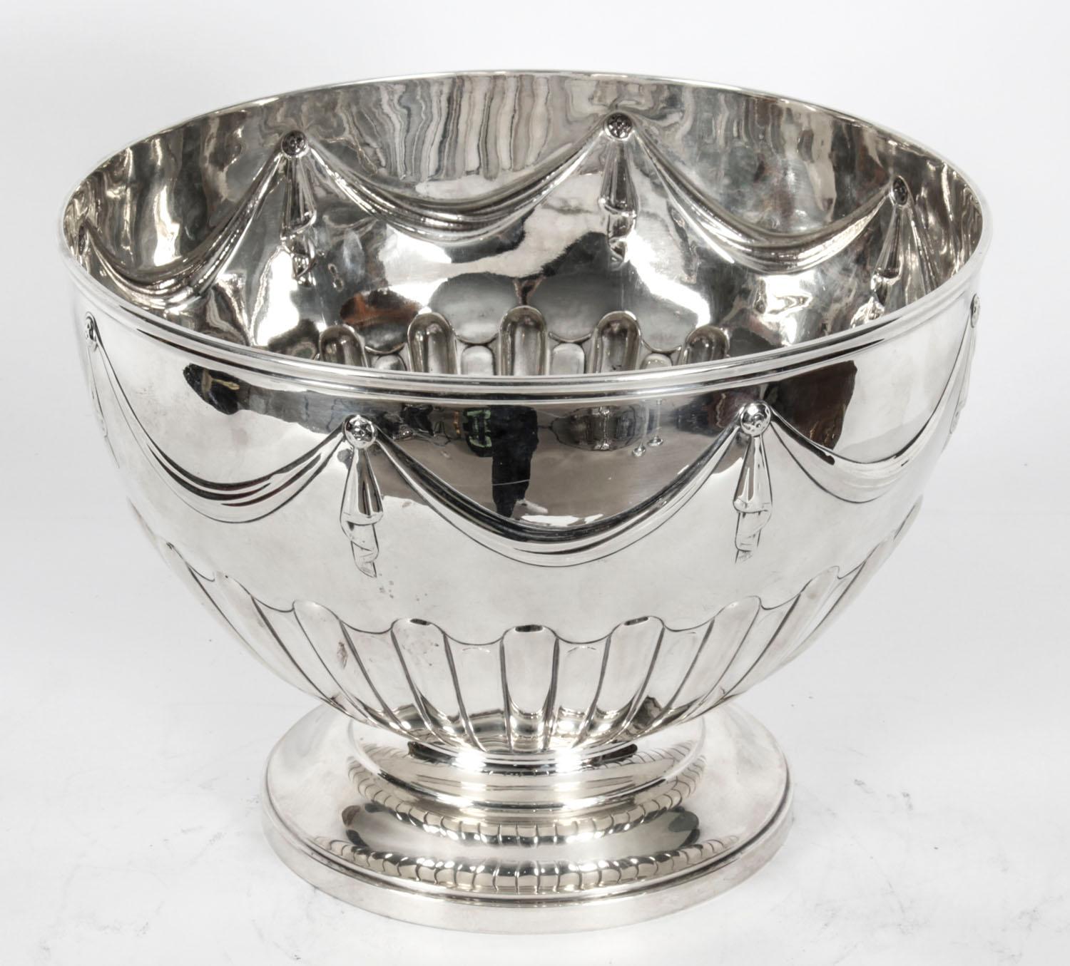 This is a gorgeous antique sterling silver punch bowl with hallmarks for London 1884 and the makers mark of the renowned silversmith family, Walter & John Barnard.
 
This exquisite punch bowl is also ideal as a champagne cooler and it has