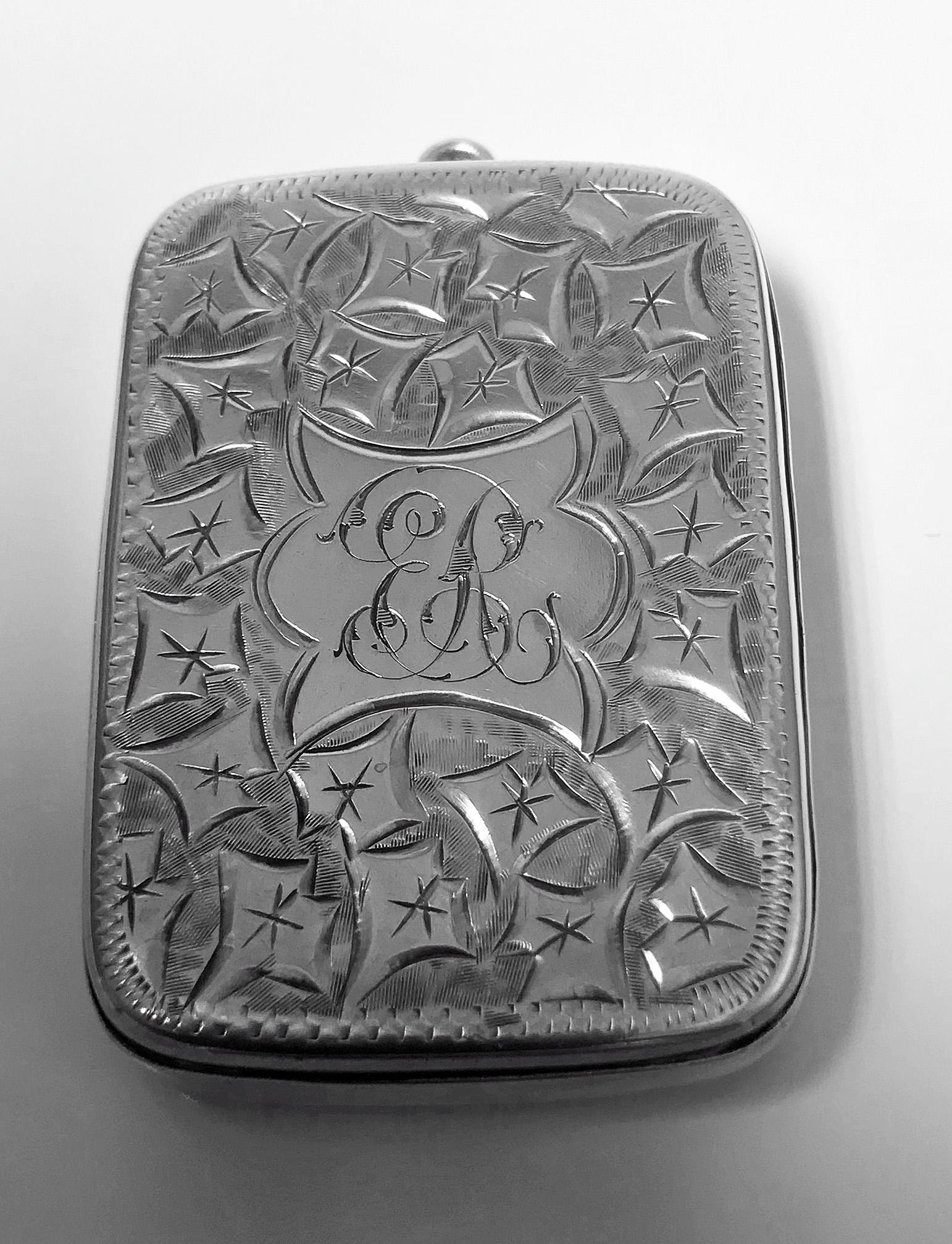 Antique Victorian Silver Puzzle Vesta Case, Birmingham 1898 Joseph Gloster. Rectangular cushion form with push `puzzle’ hinge to open. Cover and interior hallmarked. Elaborately engraved decoration, centre engraved ER. Gilded hallmarked interior.