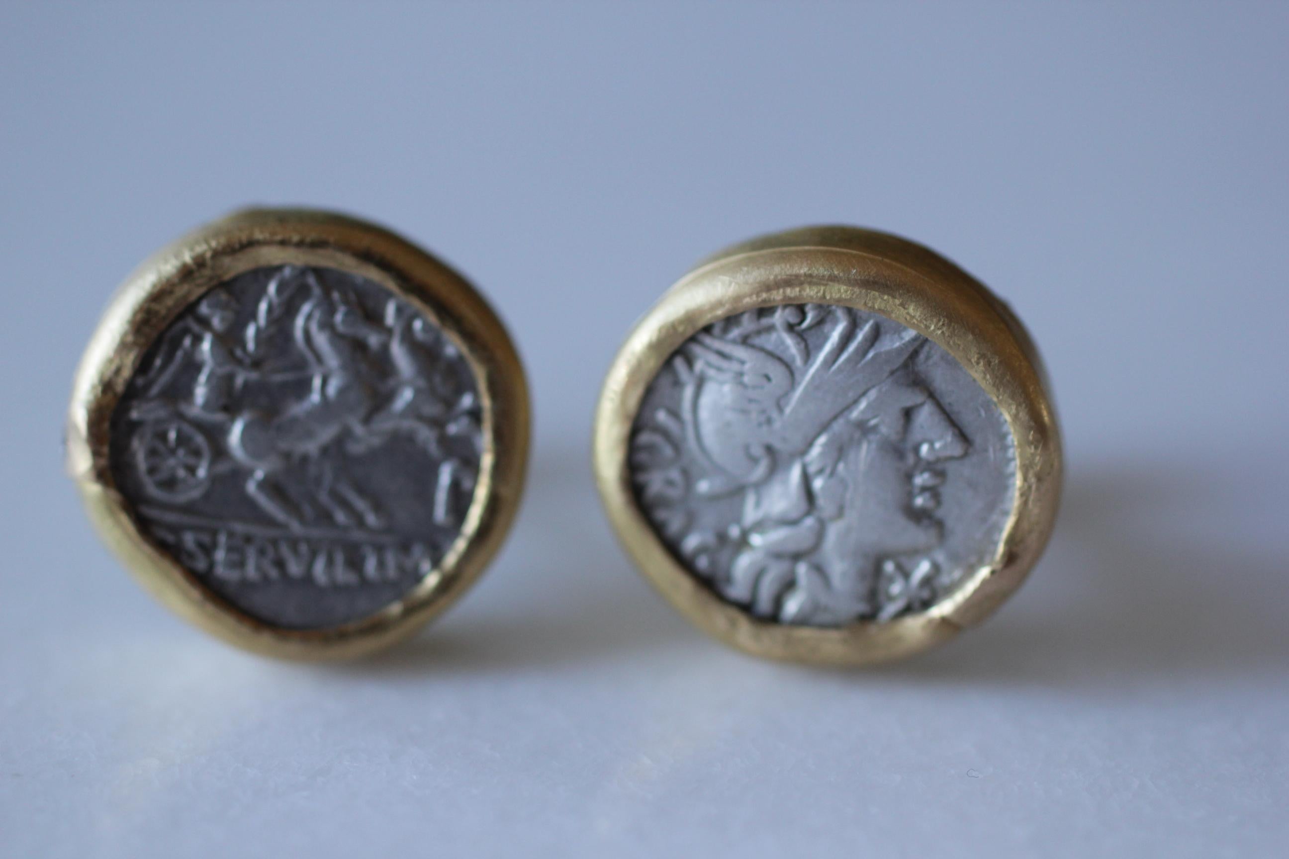Antique 2nd Cent BC Roman coin cufflinks, set in 21k gold bezels, styled with small diamond accents. Contemporary jewelry design by AB Jewelry NYC

The inspiration for these cufflinks comes from the coins' imagery, the interpretive spirit of Modern