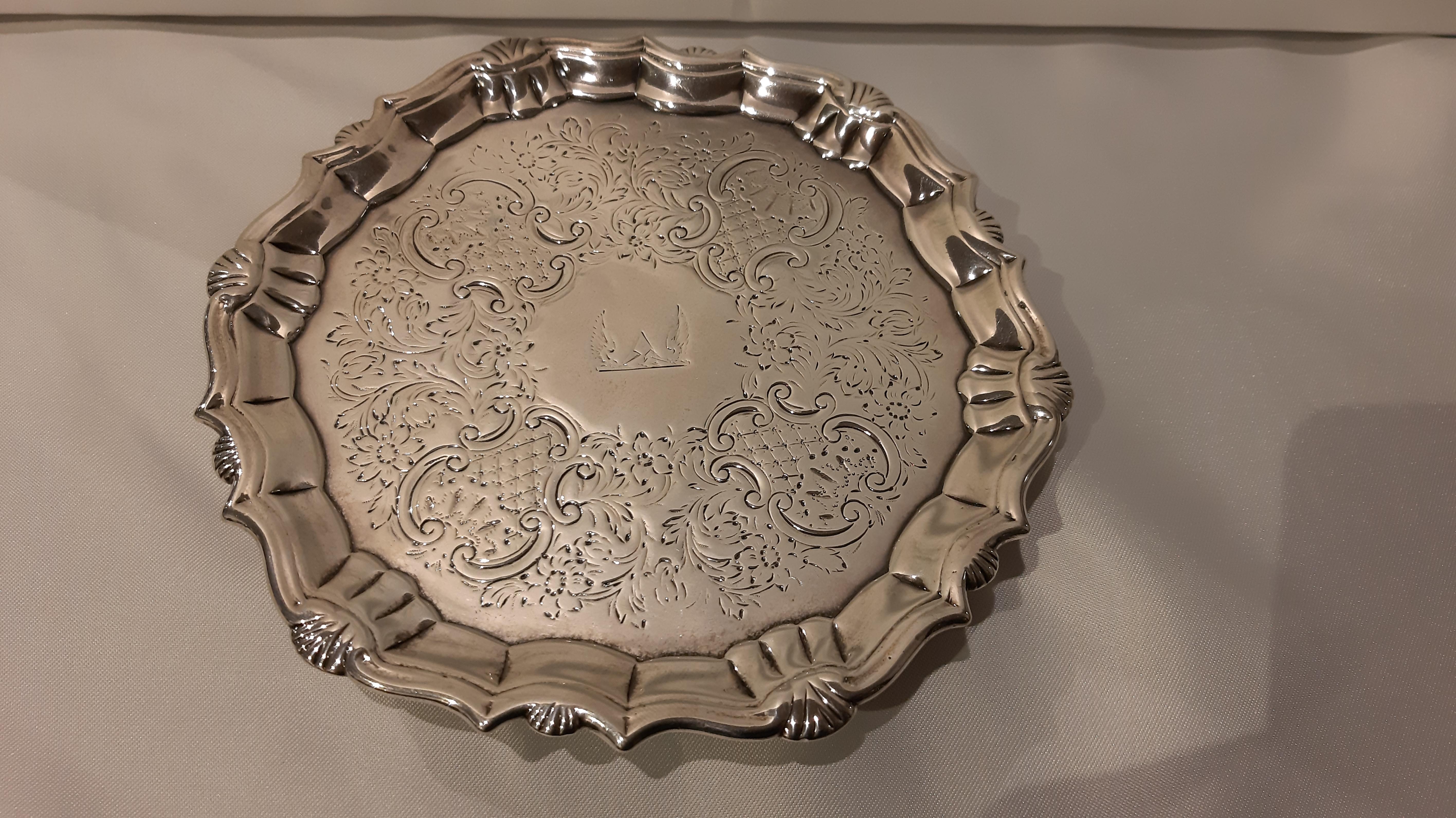 Antique silver salver backed with feet. Punches by silversmith R. Abercorn. In excellent condition, free from previous breakages or restorations, beautifully and completely chiseled in the central reserve.