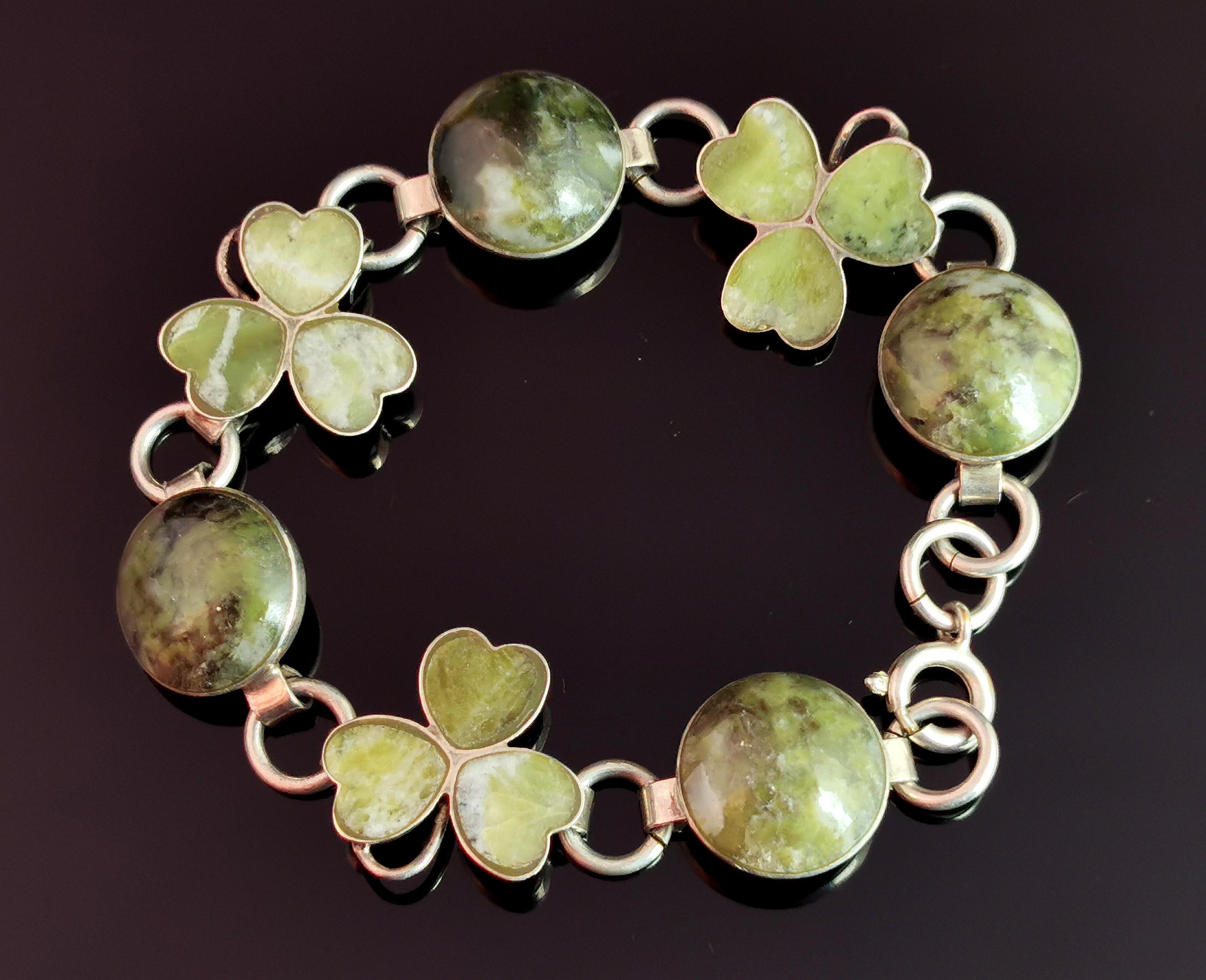 A gorgeous antique sterling silver and Connemara marble shamrock bracelet.

This is such a beautiful piece with stylised silver Shamrock or clover leaves, set with a rich green connemara marble, each marble leaf section shaped like heart.

The
