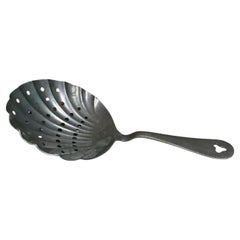 Cuchara ranurada con colador de plata antigua