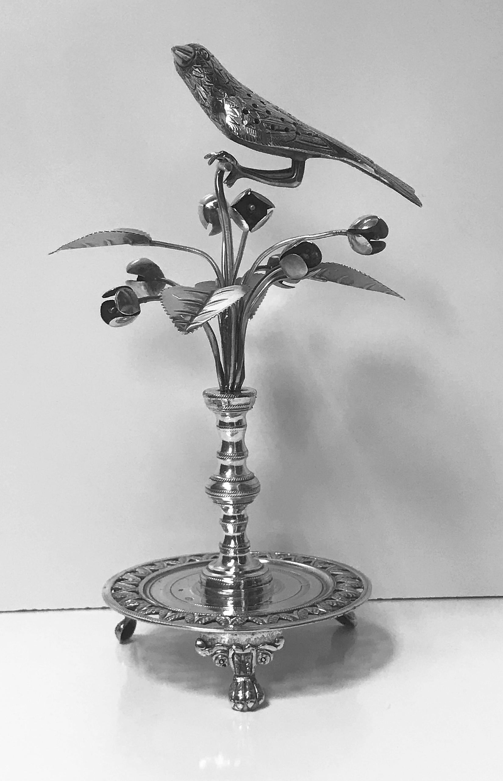 Rare Antique Silver Toothpick Holder, Rio de Janeiro Brazil C.1850. The holder in the form of an exotic bird surmounted on bud flower foliage branches on knopped stem in turn on circular pierced foliage and wriggle work base on three turned knuckle