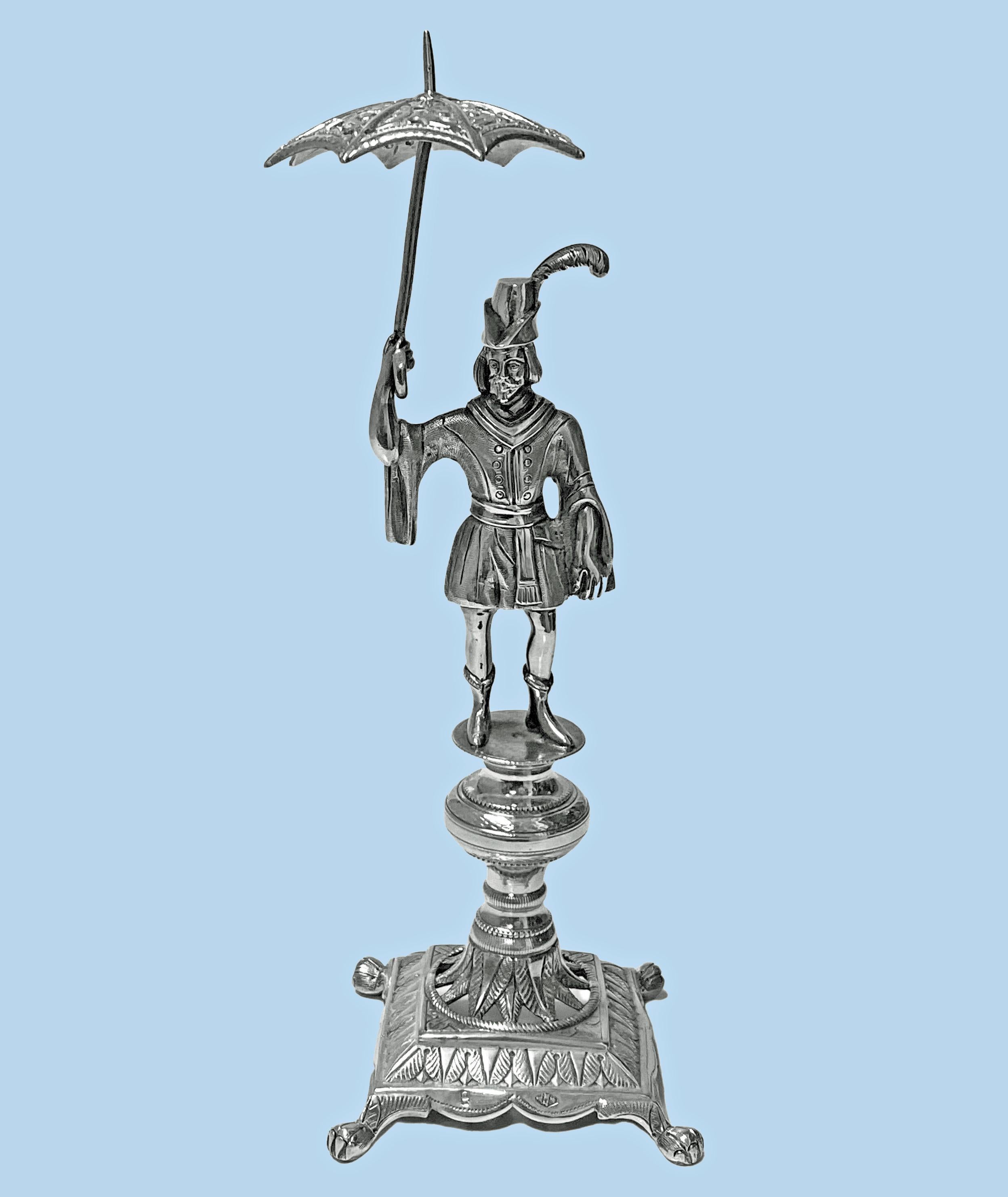 Antique silver toothpick or cocktail stick holder, Rio de Janeiro, Brazil, circa 1850. The holder in the form of a continental livery uniformed male figure holding an open umbrella with pierced holes for toothpicks or cocktail sticks. The holder on