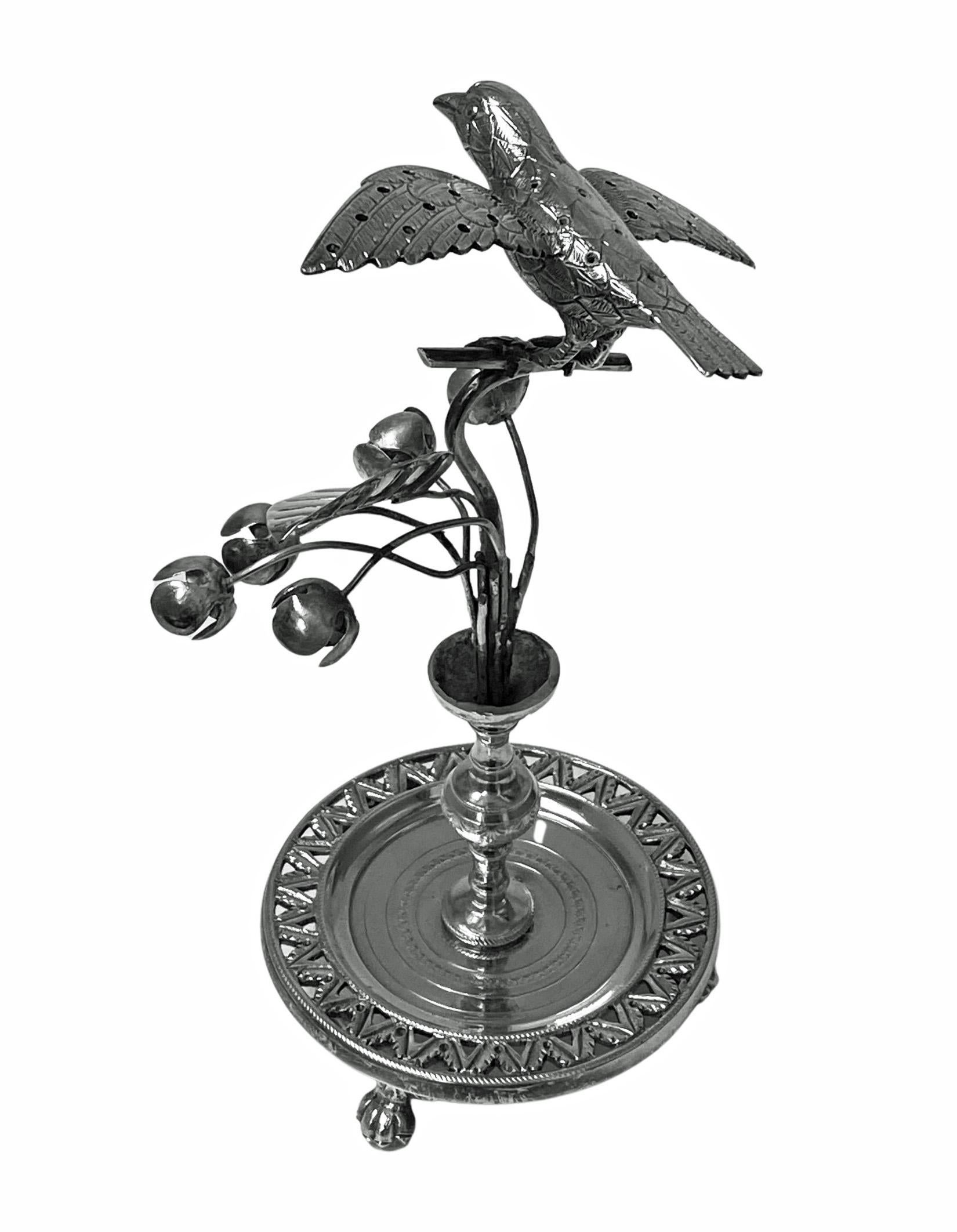 Antique silver toothpick or cocktail stick holder, Rio de Janeiro, Brazil, circa 1850. The holder in the form of an exotic bird surmounted on bud flower foliage branches on knopped stem in turn on circular pierced foliage and wriggle work base on