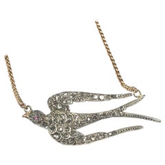 Collier pendentif oiseau ancien en argent avec pendentif en or et diamants taille rose sur le dos