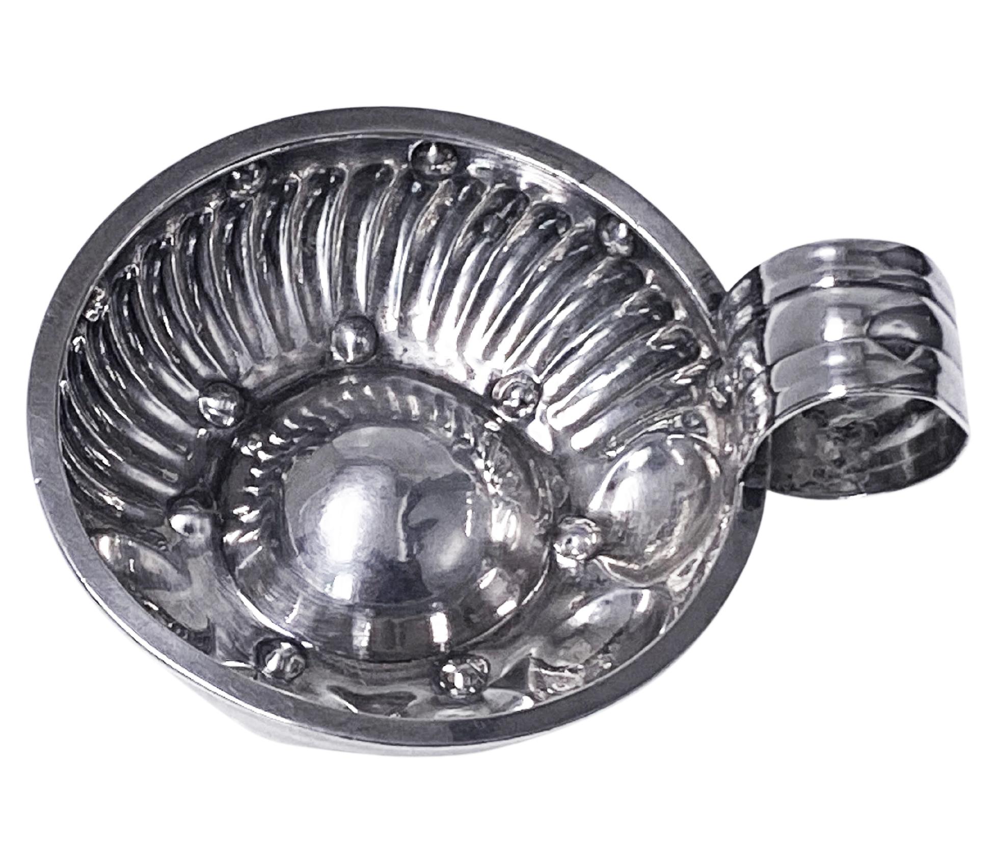 Antique French 1st std silver wine taster tastevin circa 1880, Cesar Tonnelier, Minerva head 1st std. The tastevin of usual form, the lower part of bowl with a surround of concave and swirl lobate style decoration, ribbed thumb piece handle. Marked