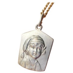 Antique silver young child portrait pendant