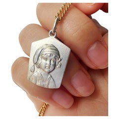 Antique silver young child portrait pendant