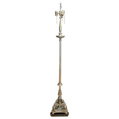 Lampada da terra barocca figurata in bronzo argentato antico