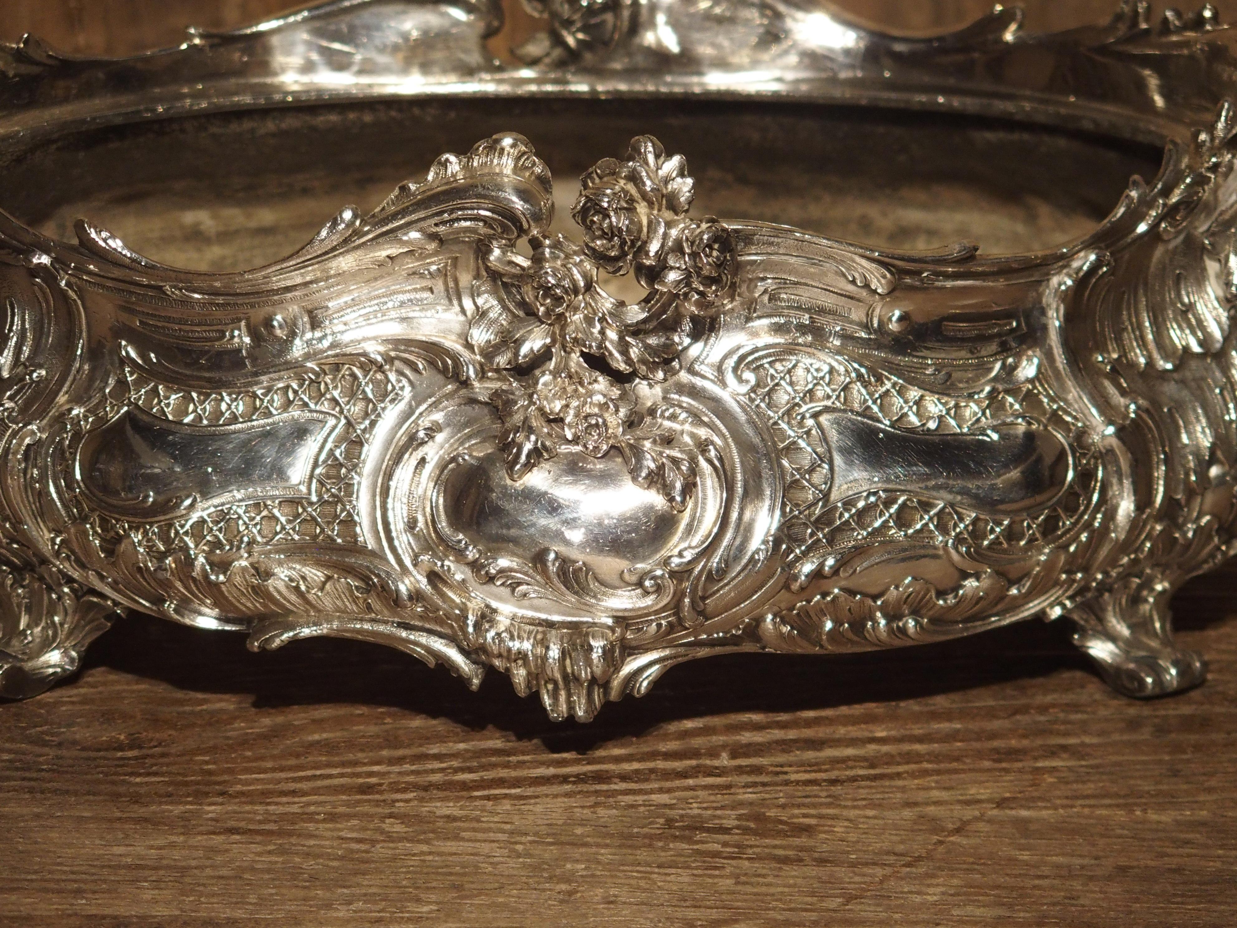 From France, this Louis XV style silvered bronze jardinière dates to the 19th century. It was made in the late 1800s, during a renewed interest in the great art of the 17th and 18th centuries. The motifs are those that were used during the 1700s: