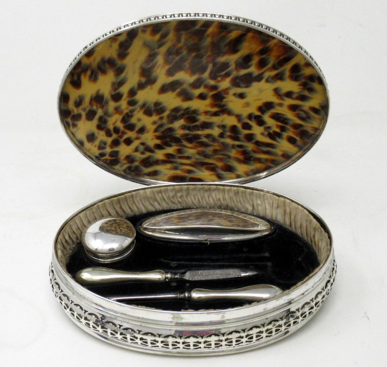 An exceptionally fine quality example of a Lady’s silver plated and Faux Tortoiseshell Grooming box set of English origin, late Victorian period. 

The large hinged lid oval case with faux tortoise shell domed lid enclosing original contents