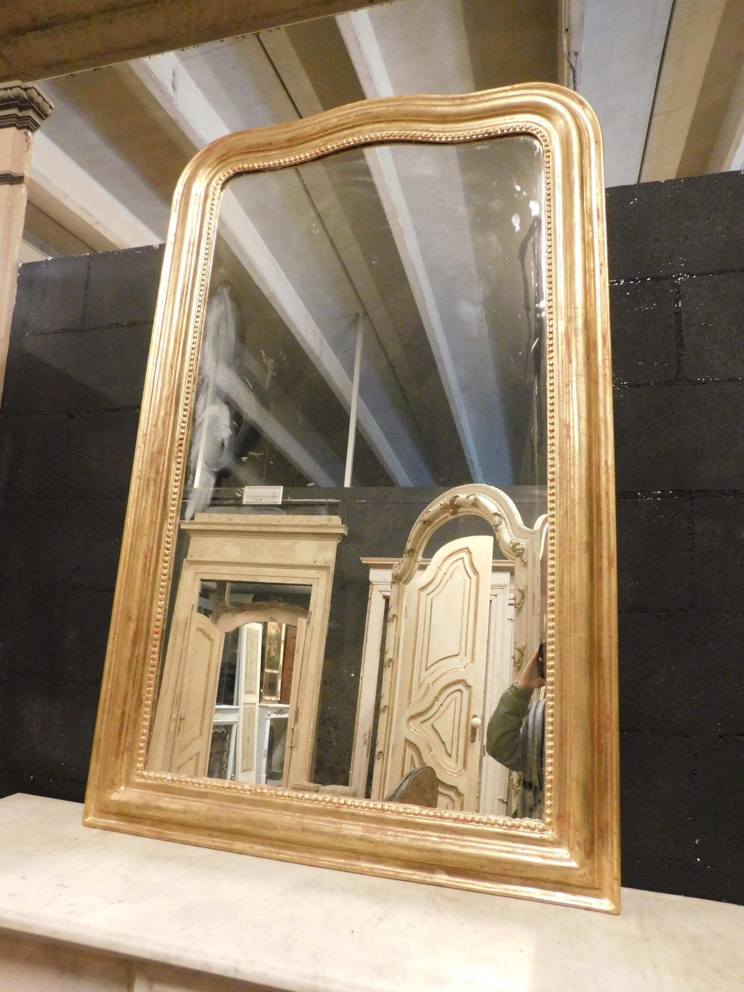 Ancient gilded wooden mirror, frame moved at the top, excellent size and workmanship, well preserved, from the 19th century, from France.