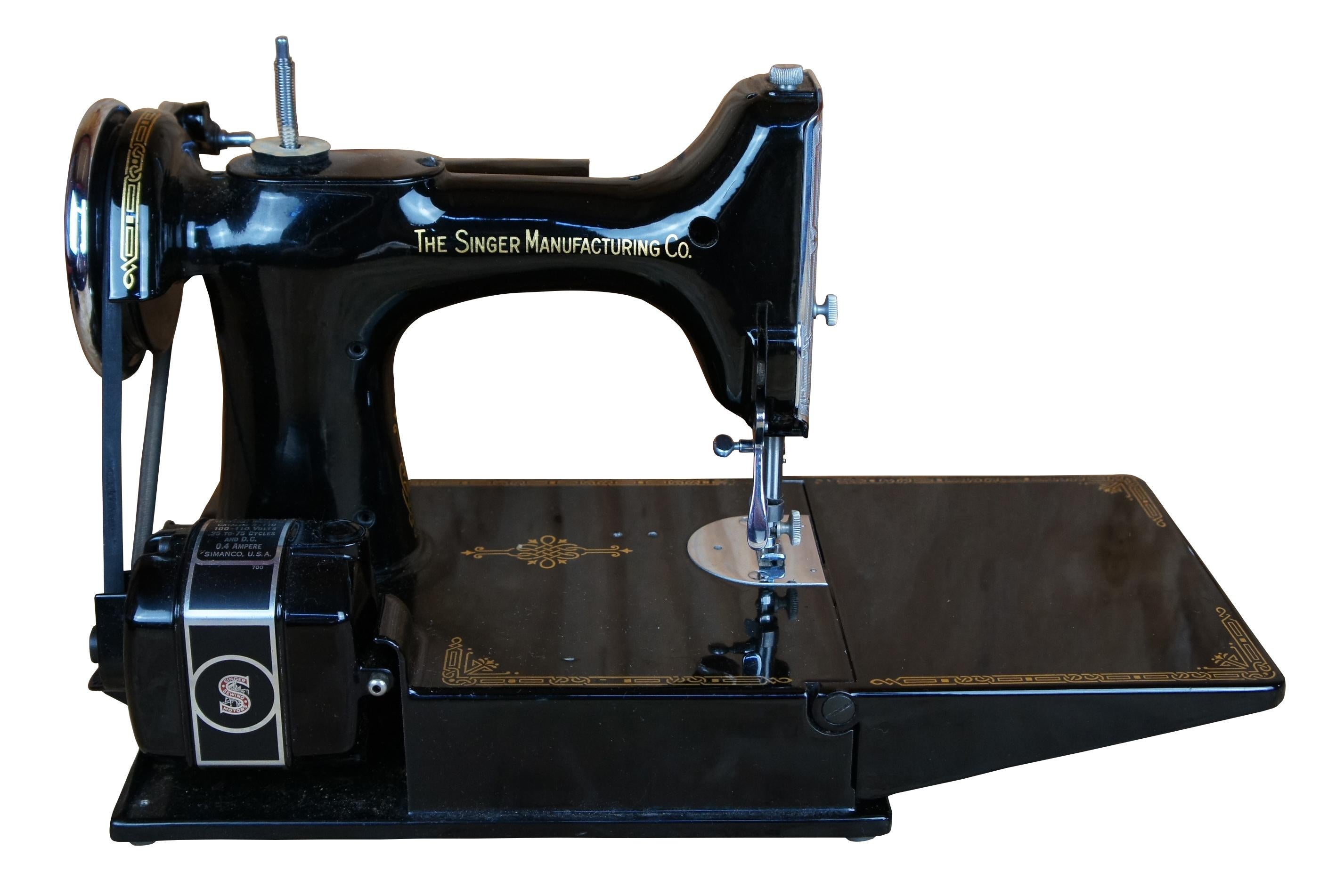 Singer Featherweight 221 portable sewing machine comes with original carrying case, manual and many extras including thread, bobbins, and additional feet.

Made in January of 1941
Serial number - AF750602

Case- 13” x 8.25” x 11.75”H, machine- 15.5”