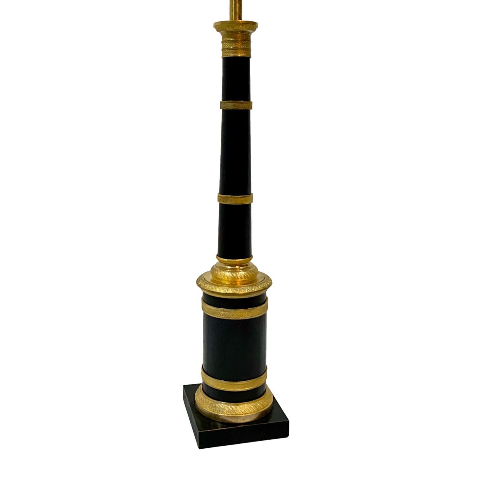 A circa 1900 French painted tole and gilt bronze table lamp with original finish.

Measurements:
Height of body: 21.5