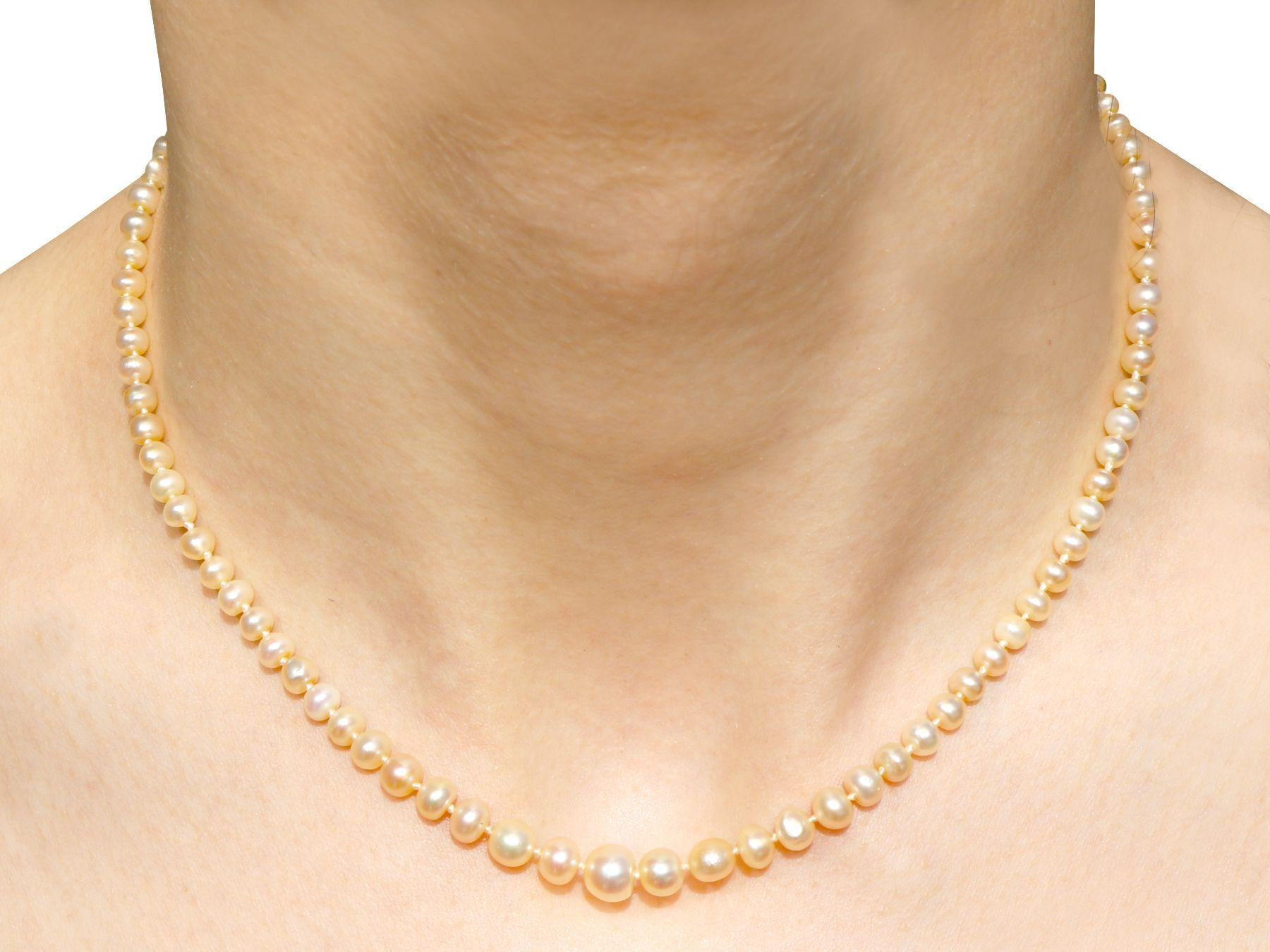 Oval Cut Antique Single Strand Natural Pearl Necklace with 1.02 Carat Diamond Set Clasp