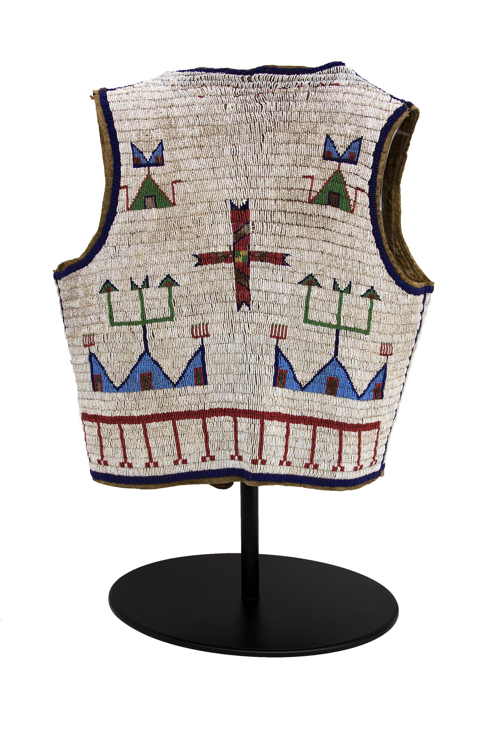 Vintage 19th century Sioux (Plains Indian) Native American antique pictorial beaded hide vest, circa 1875-1900. Pictorial design includes tipi (teepee) motifs and geometric elements in white, light blue, dark blue, red, green and metallic trade