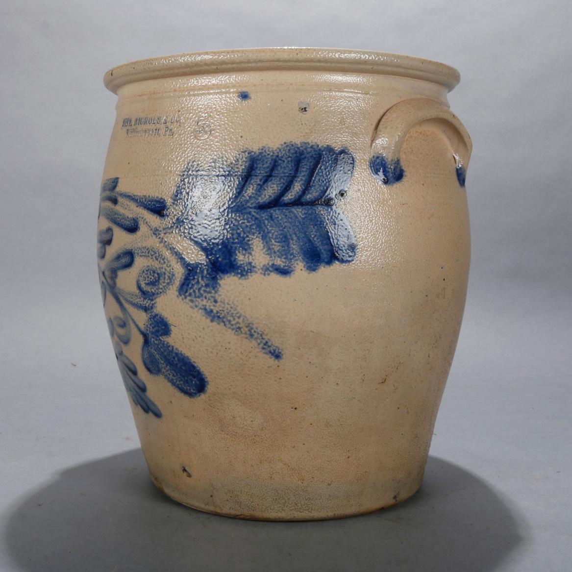 An antique stoneware crock by Sipe, Nichols & Co, Williamsport, PA offers #5 size with double handles and cobalt blue foliate decoration, 19th century

Measures: 14