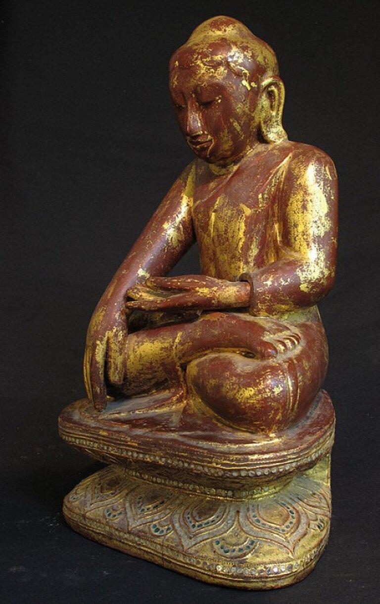 This antique wooden Buddha statue is a truly unique and special collectible piece. Standing at 43 cm high, it is made of wood and it is in the Shan (Tai Yai) style, depicting the Bhumisparsha mudra. This statue is believed to originate from Burma,