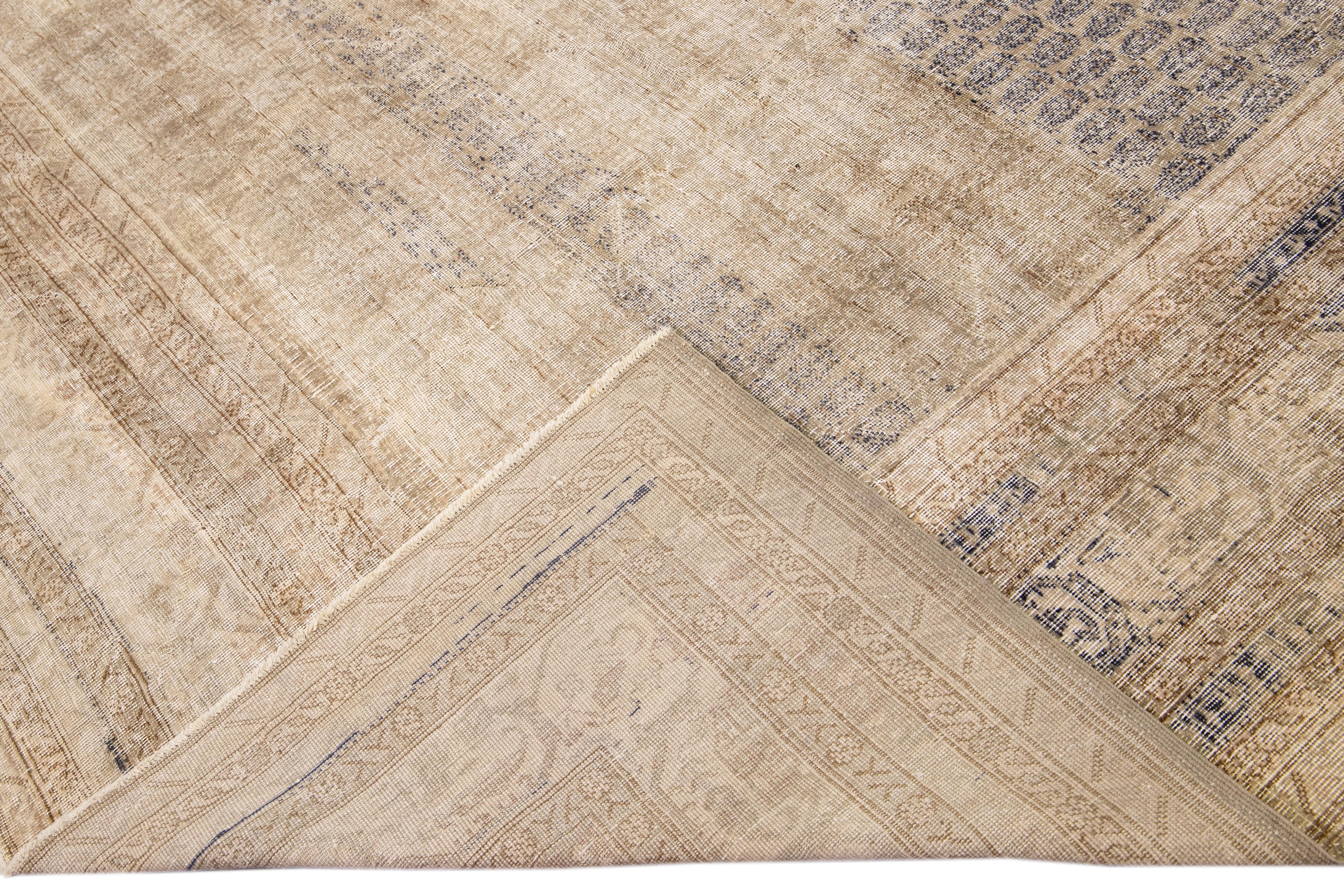 Beautiful Sivas hand-knotted wool rug with a beige field. This piece has blue borders and an accents layout on a palmettes pattern design. 

This rug measures: 11'7