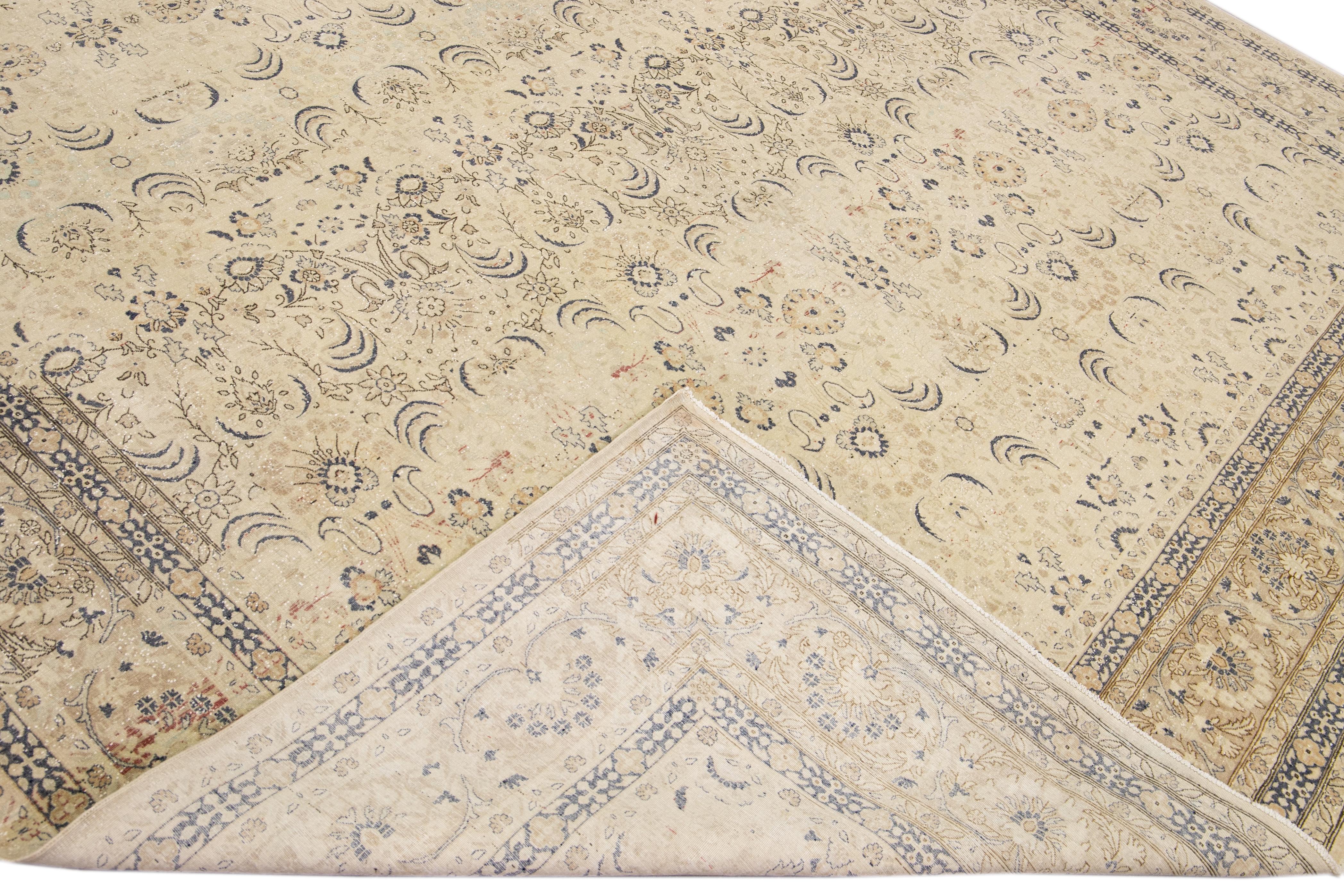 Beautiful antique Sivas hand-knotted wool rug with a beige field. This piece has a blue and brown accent in a gorgeous all-over floral Motif design.

This rug measures: 10'2