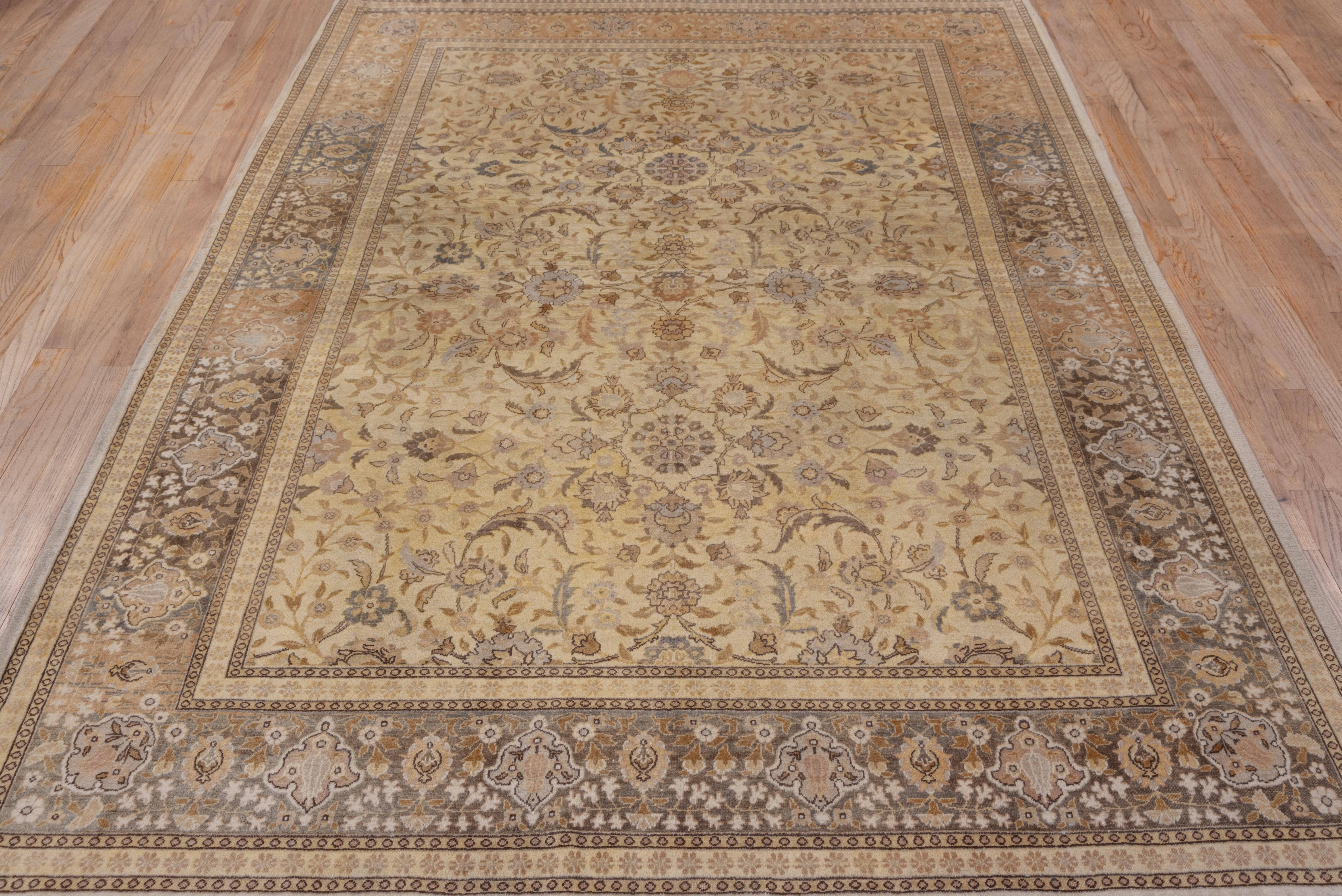 This finely woven eastern Turkish city rug features a sandy ivory field with open octogrammes enclosing complex rosettes, various palmettes and vigorous leaves. The well-abrashed green border displays escutcheon palmettes and hyacinth sprays. The